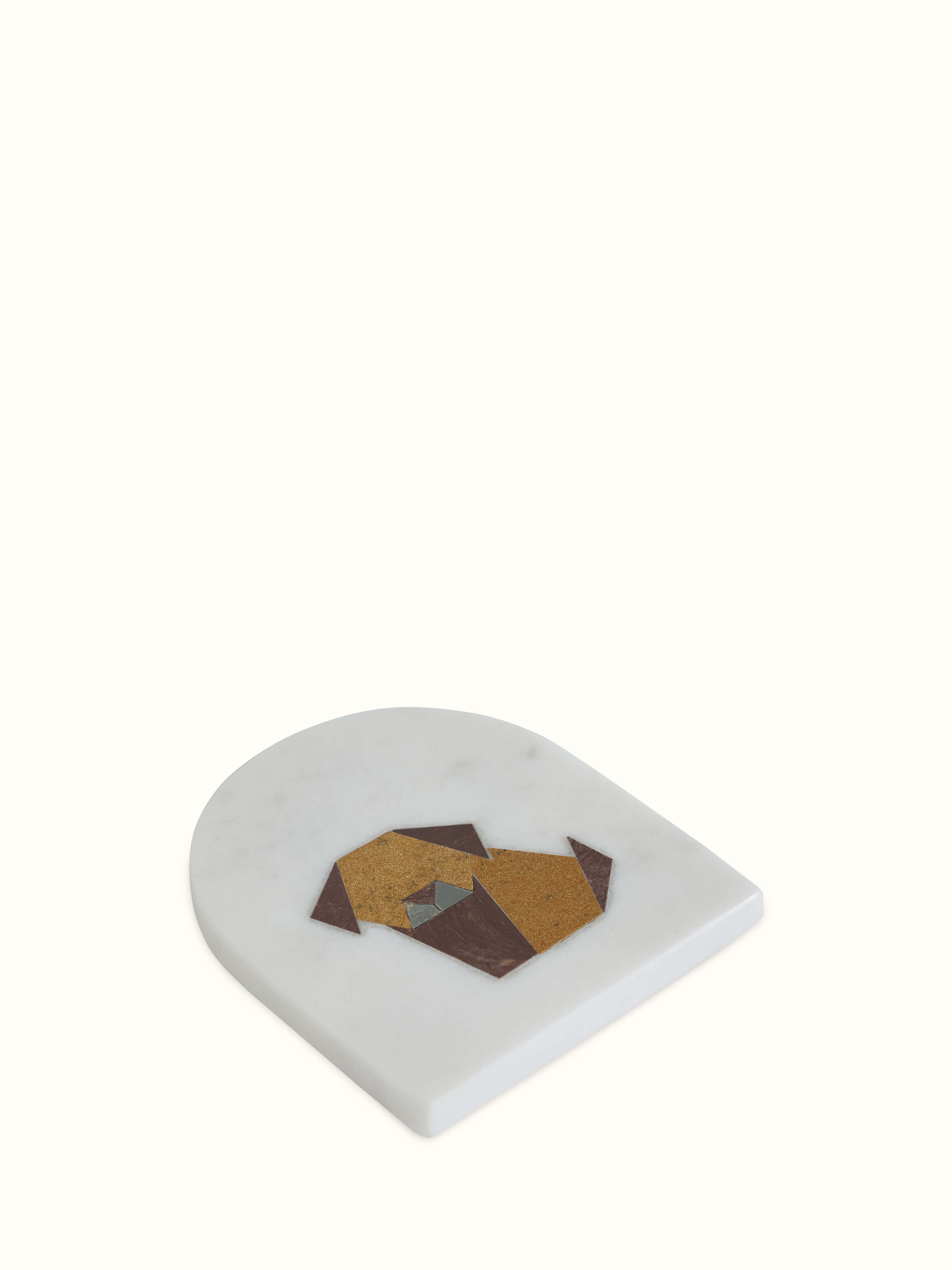 Close-up detail of animal motif marble coaster craftsmanship