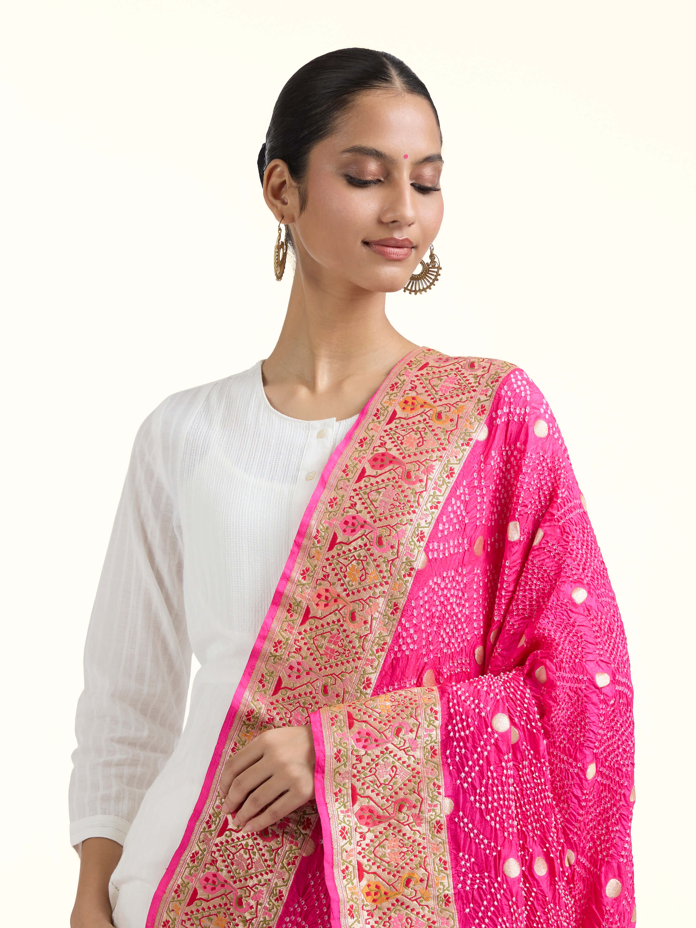 Angled view of Dark Pink Bandhani Tie & Dye Silk Dupatta revealing the depth of its color and intricate pattern