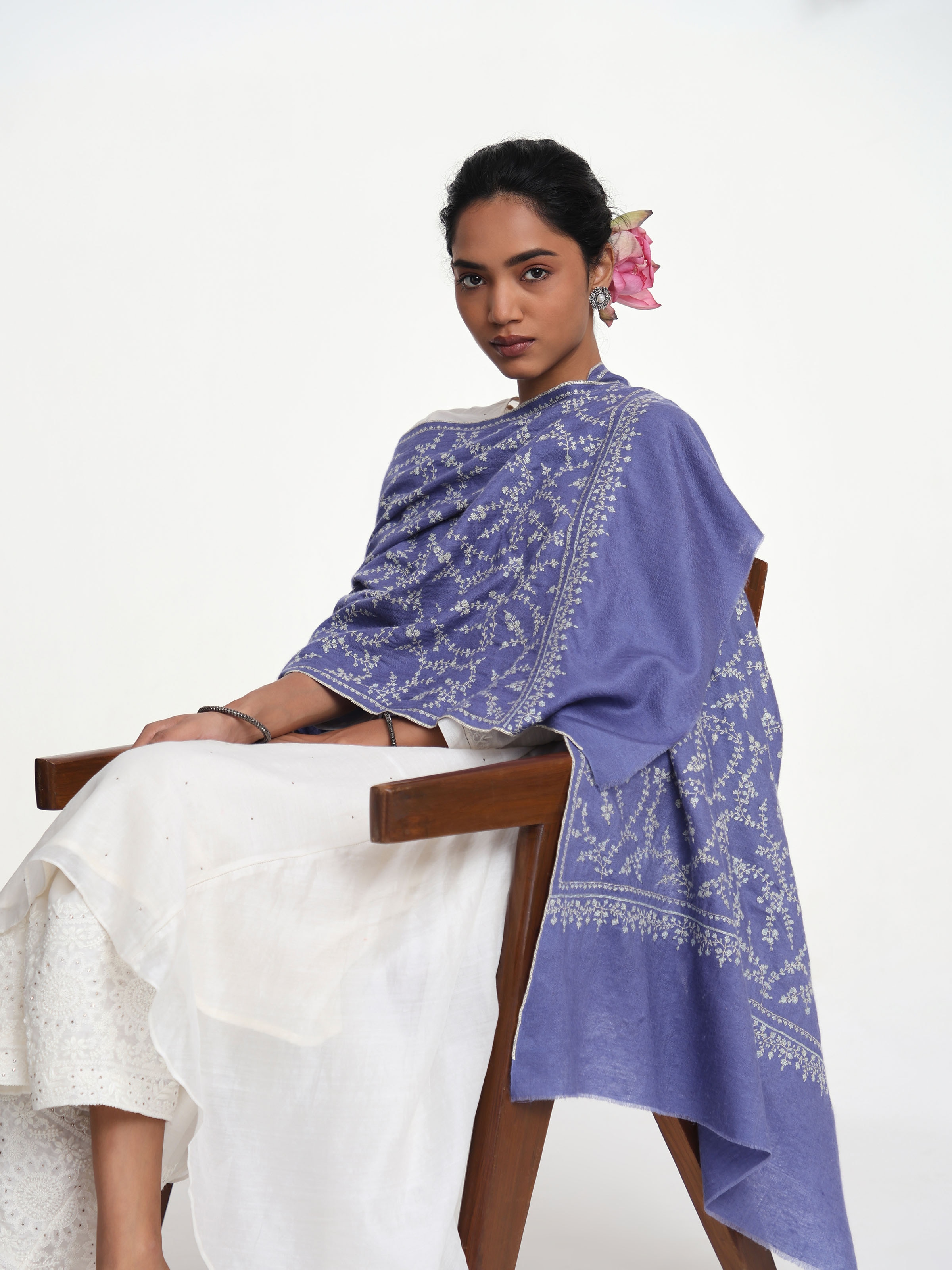 Angled view of black jalidar sozni embroidered stole emphasizing fine stitch work