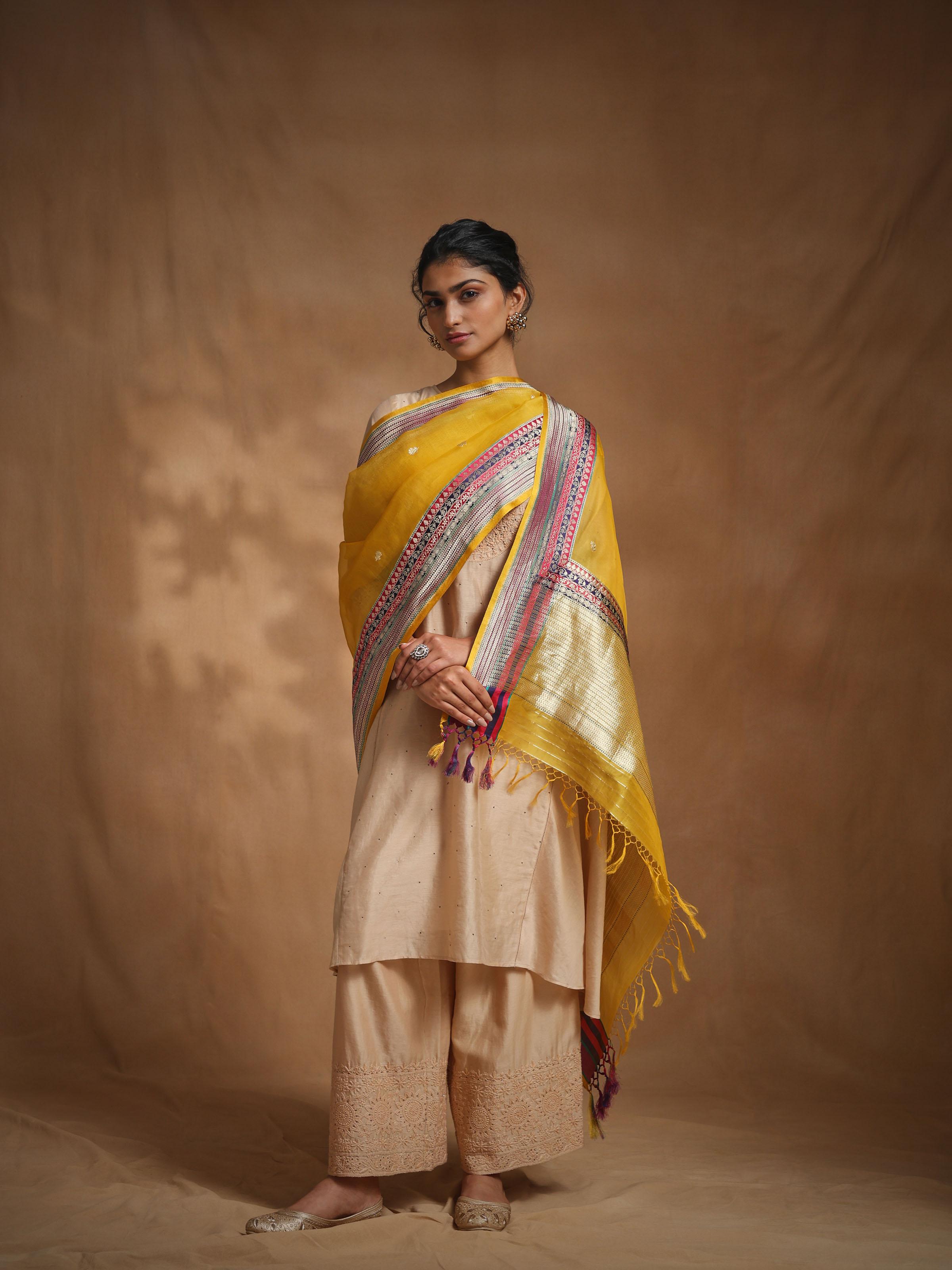 Yellow Banarasi silk dupatta displayed with elegant drape styling