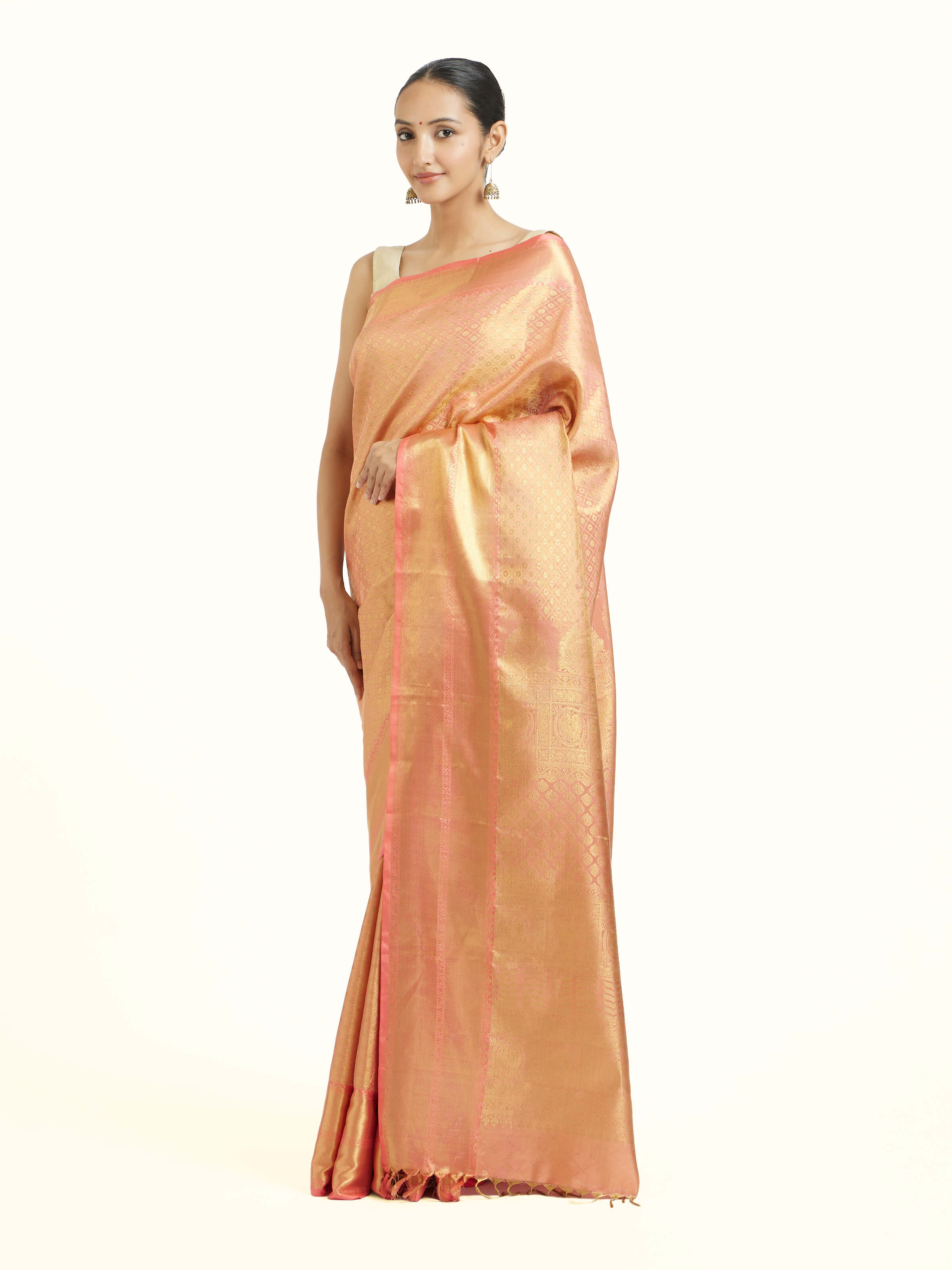 Side view of peach silk Kancheepuram saree showcasing silk sheen