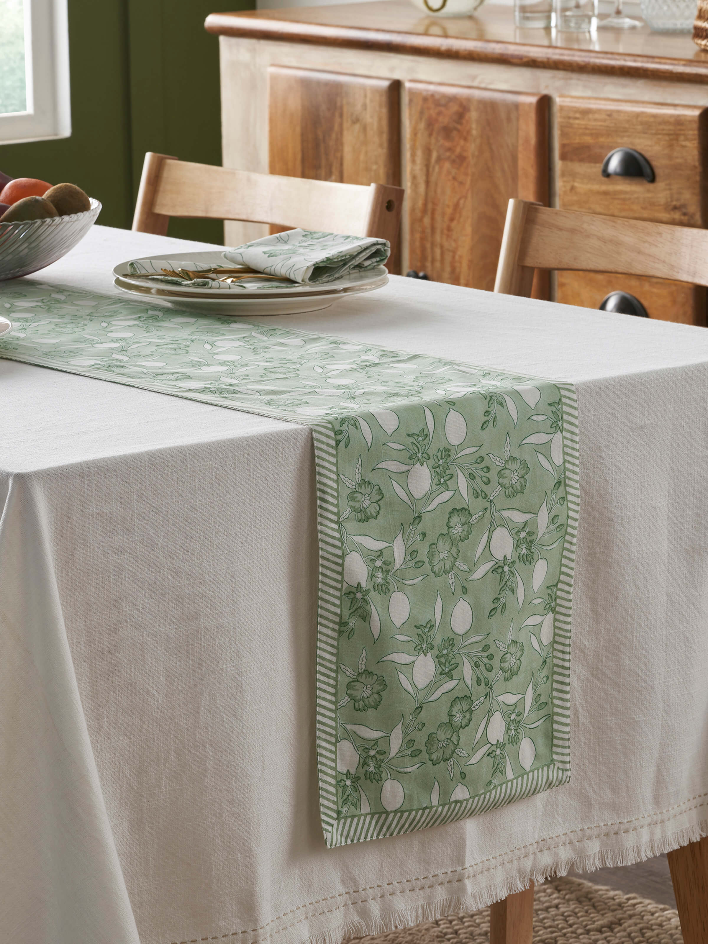Top-down shot highlighting the full length and vibrant pattern of the table runner
