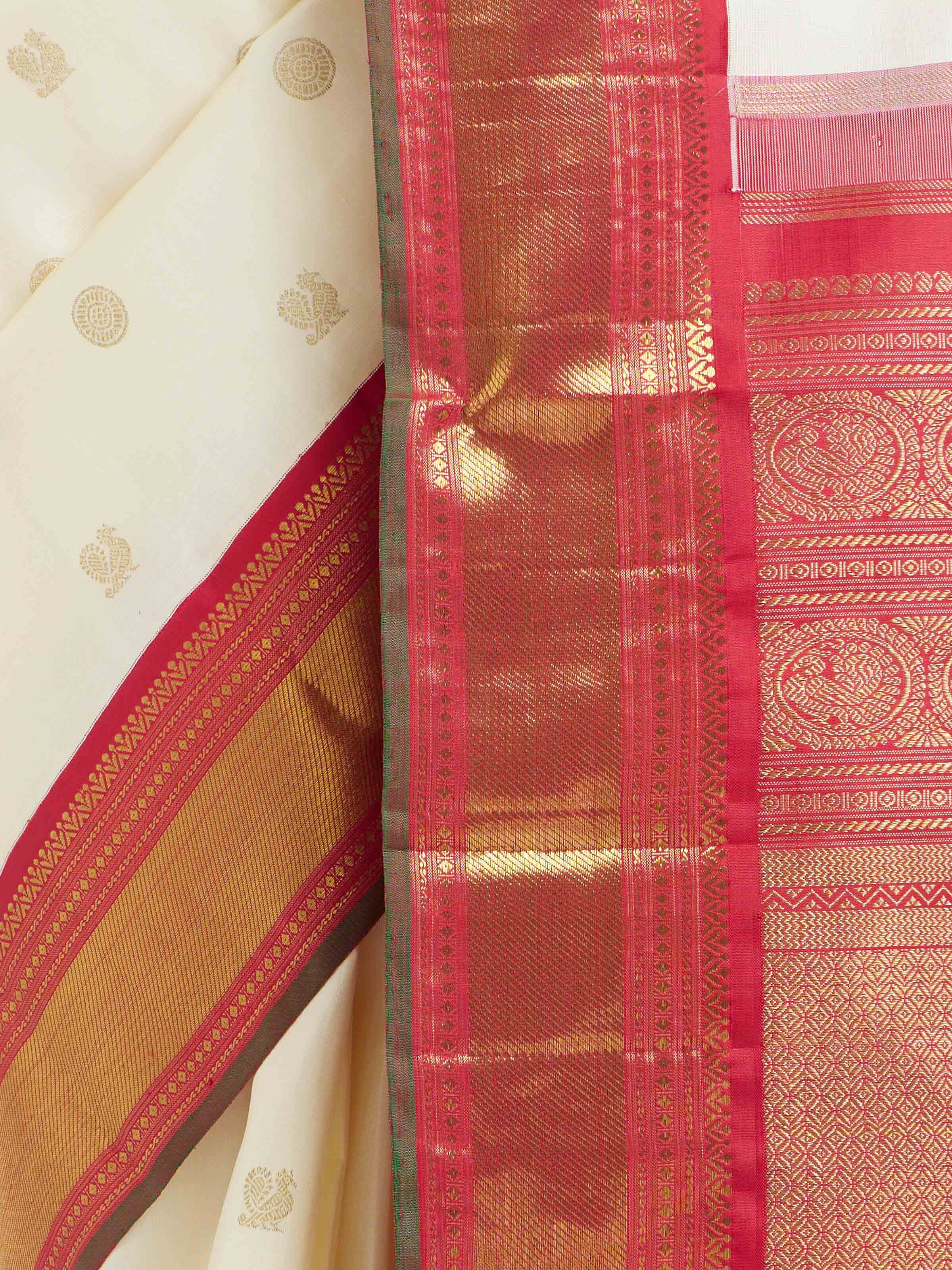 Detail view of off-white silk Kancheepuram saree showing silk texture and zari craftsmanship