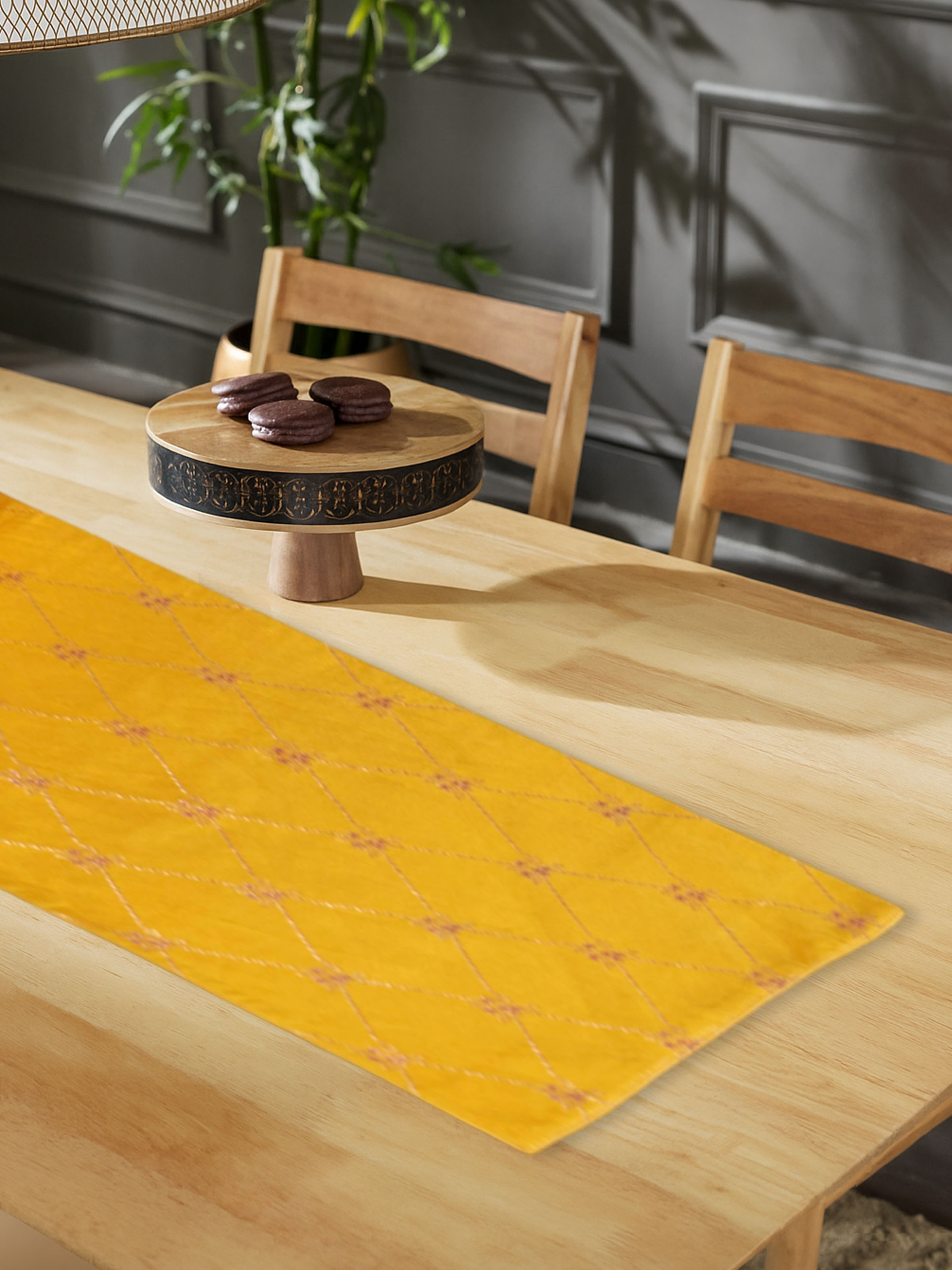 Saumya yellow silk Banarasi brocade handloom table runner styled on dining table – Swadesh
