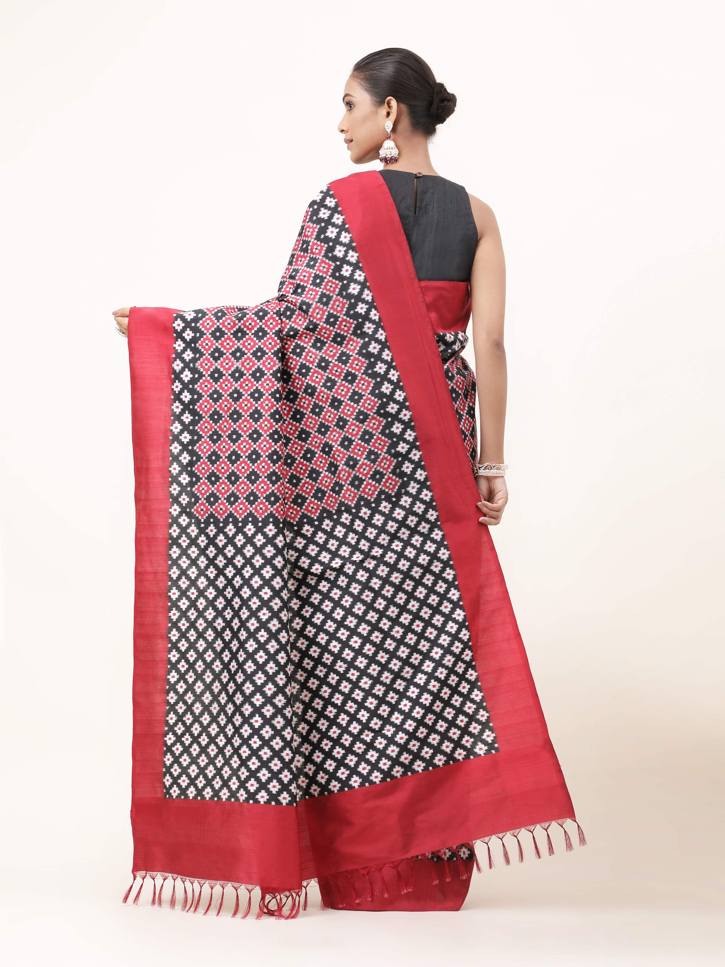 Back view of black silk double Ikat Telia Rumal saree with pallu pleats