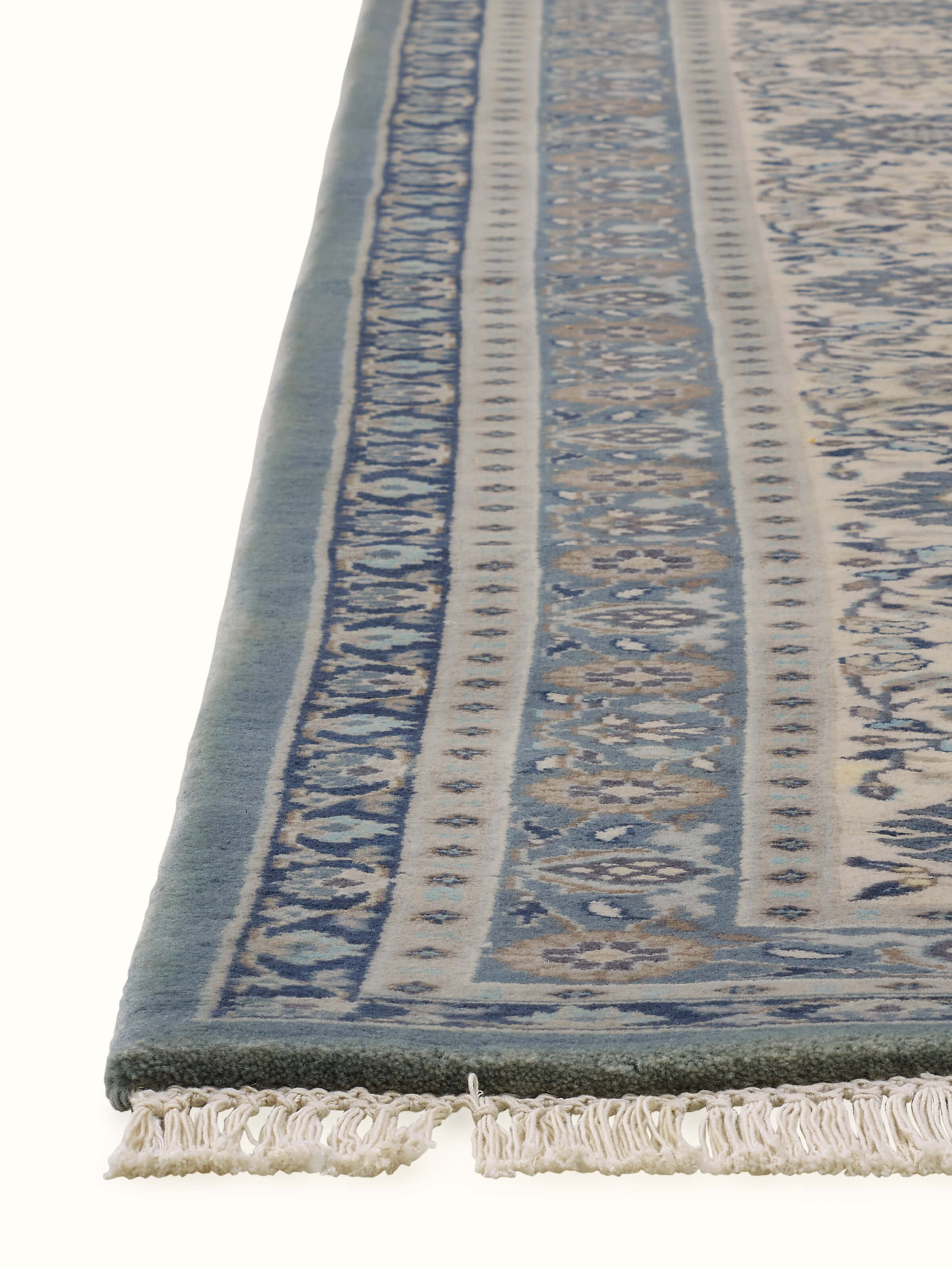 Angled view displaying intricate detailing and ornate border of Bhadohi wool Sarouk rug
