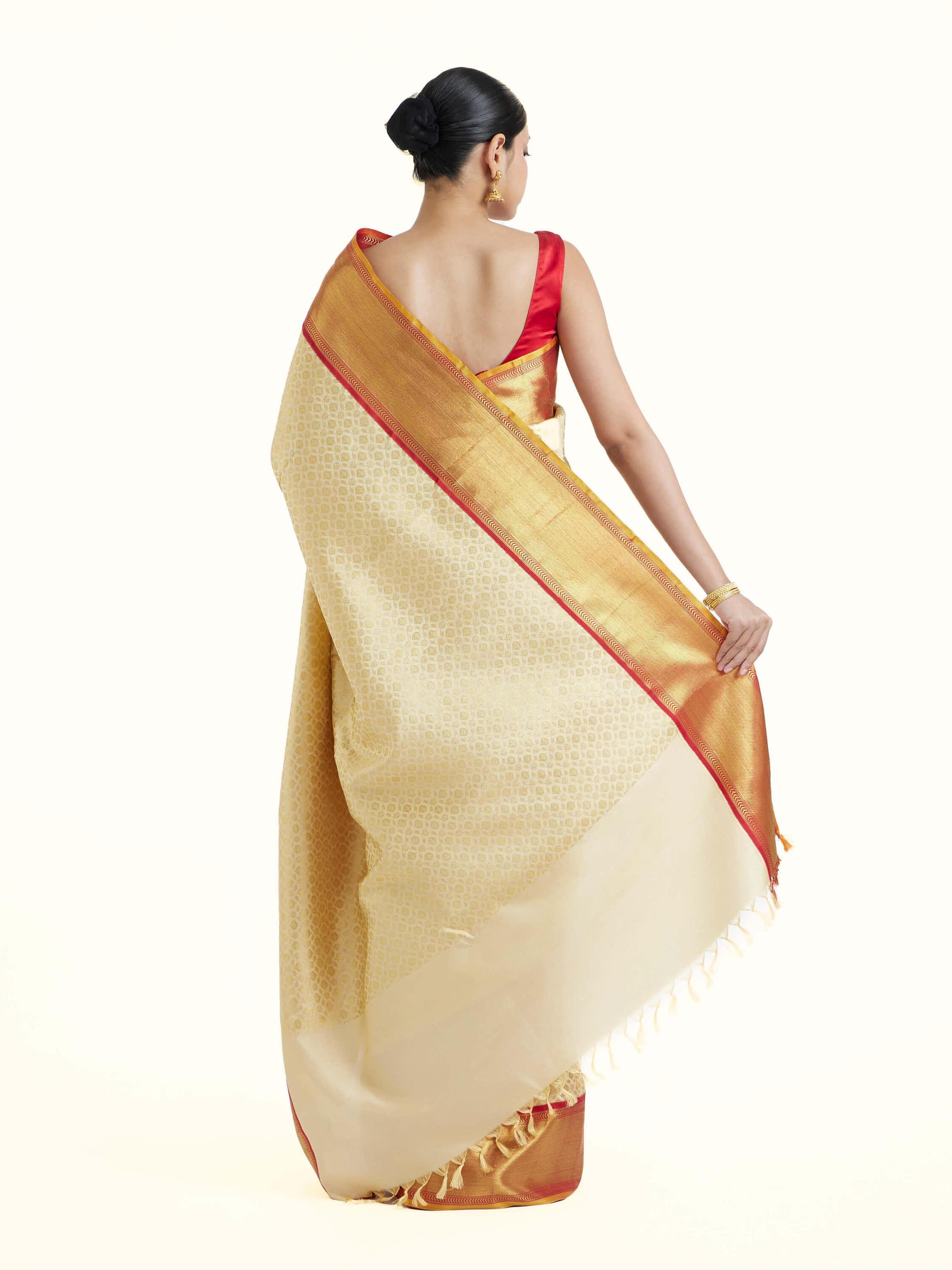 Back view of peach silk Kancheepuram saree displaying full pallu and overall elegance