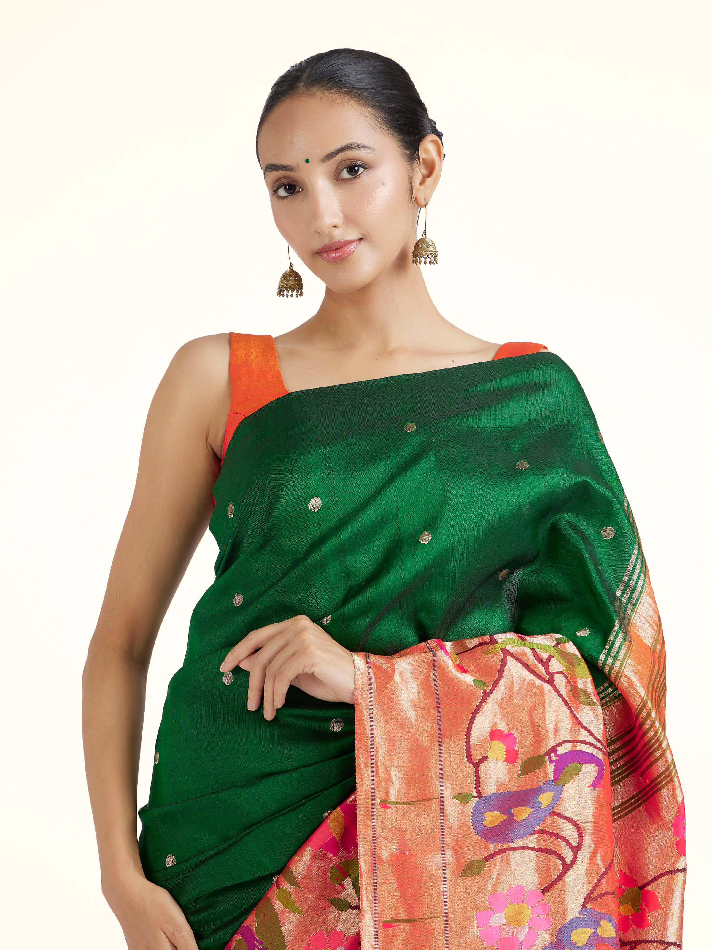 Angled view of green silk Paithani saree emphasizing classic Paithani weave