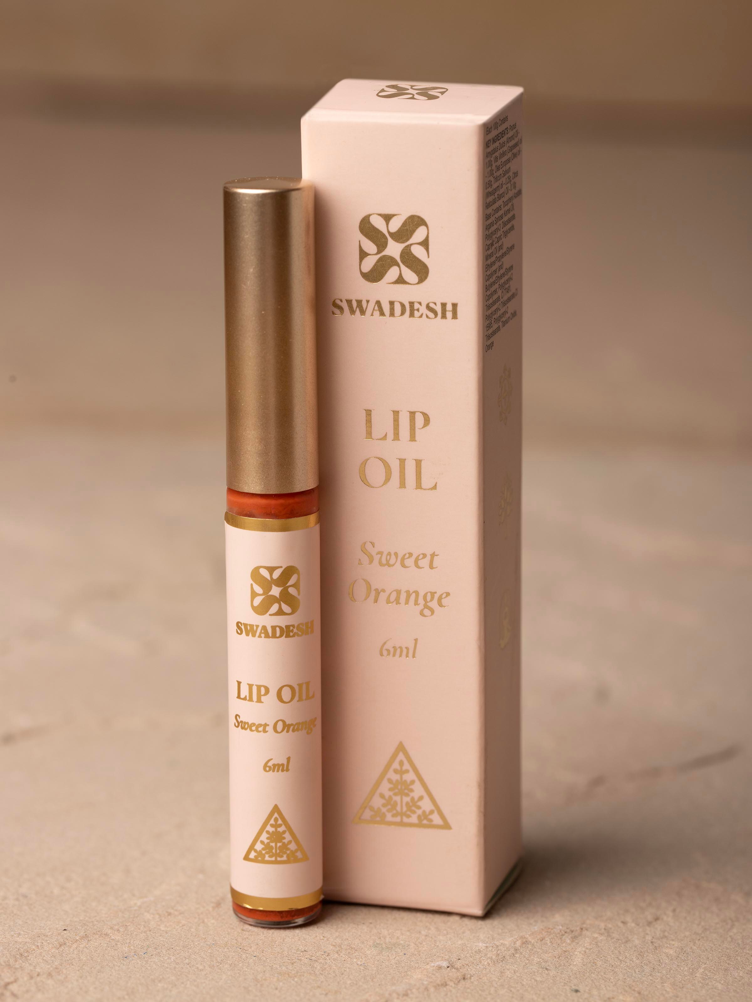 Side view of Lip Oil Sweet Orange emphasizing its moisturizing properties and citrus scent