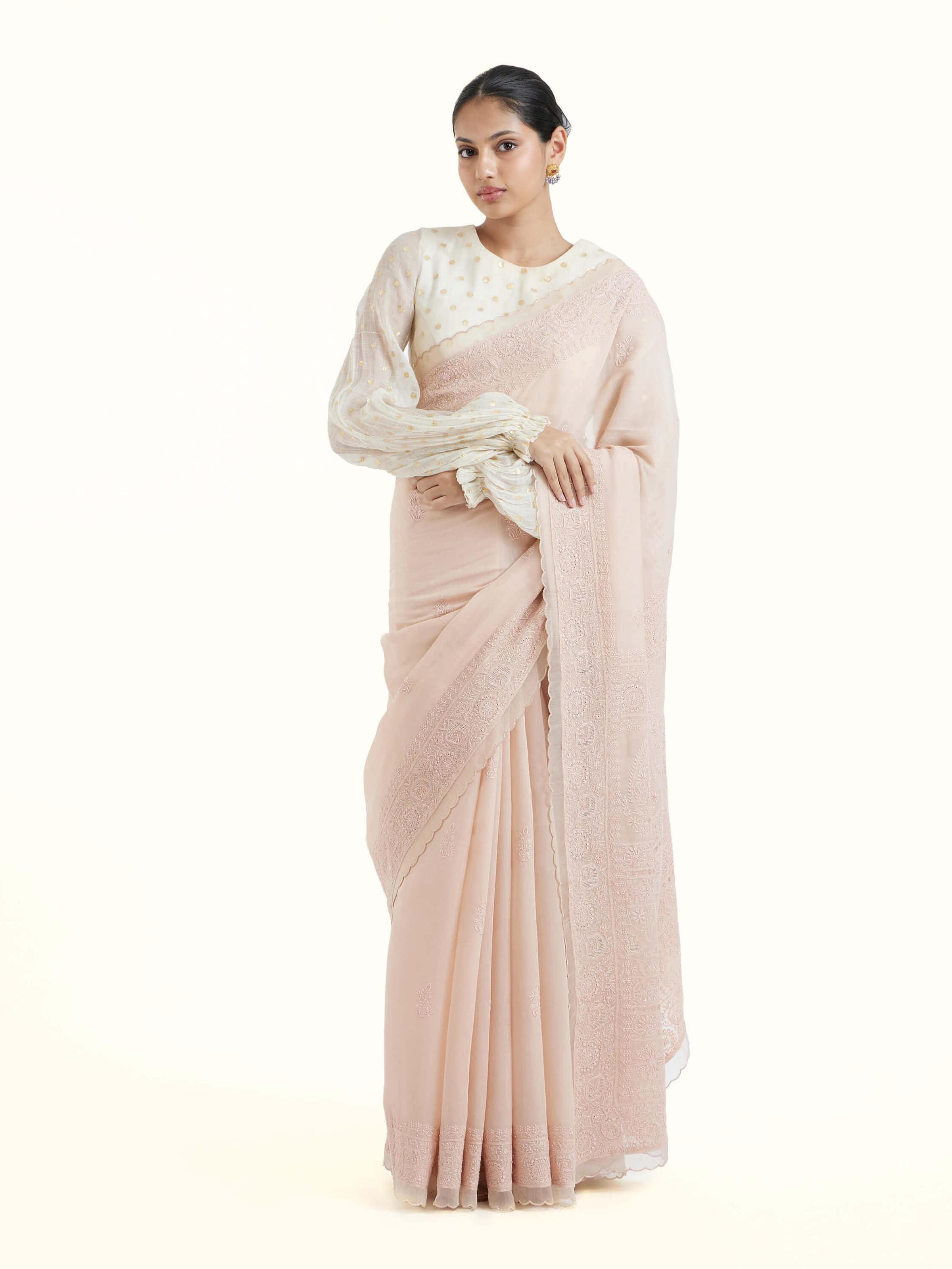 Front view of pink cotton silk chikankari saree with delicate white embroidery