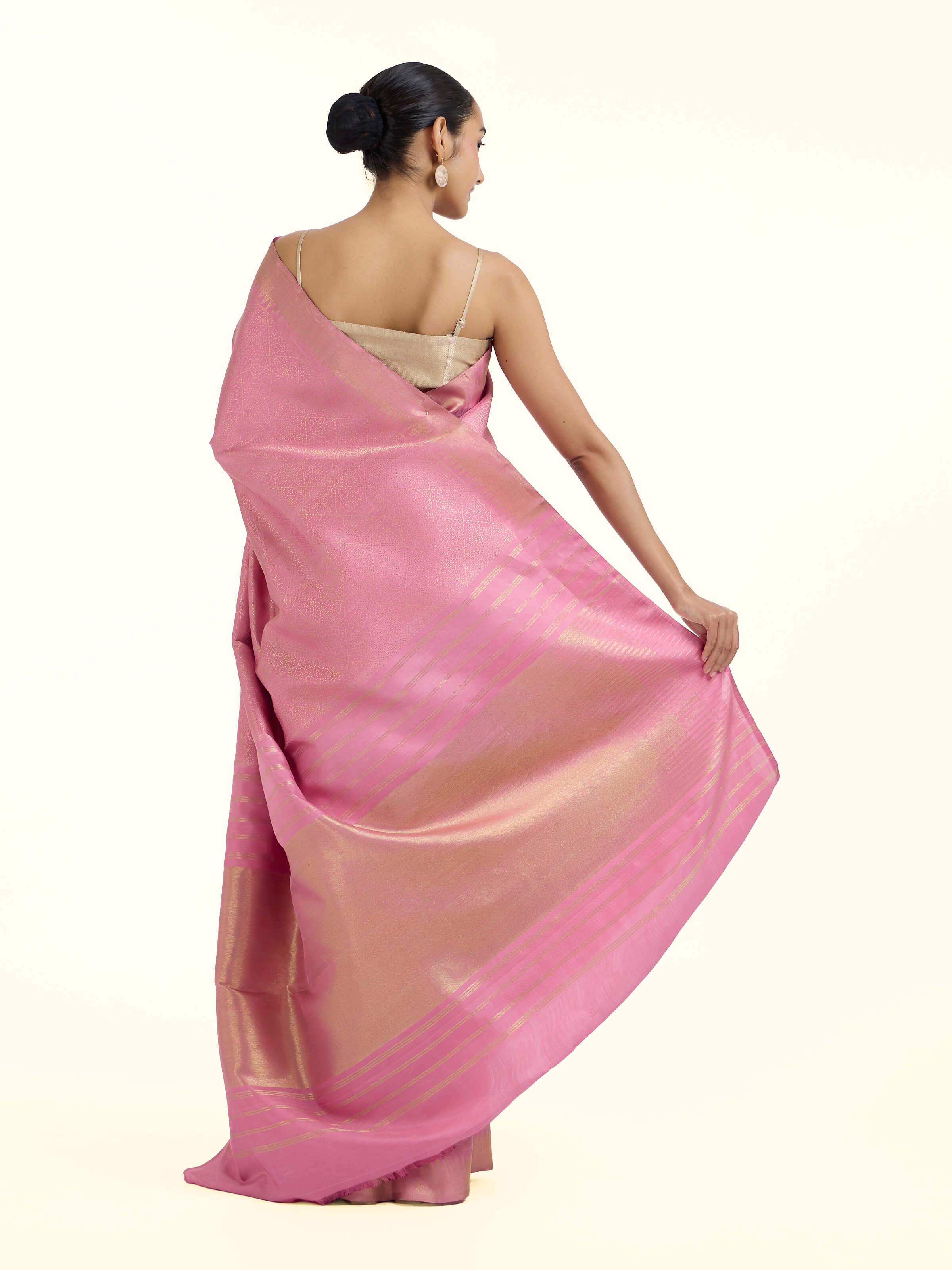 Back view of light pink silk Kancheepuram saree displaying ornate pallu