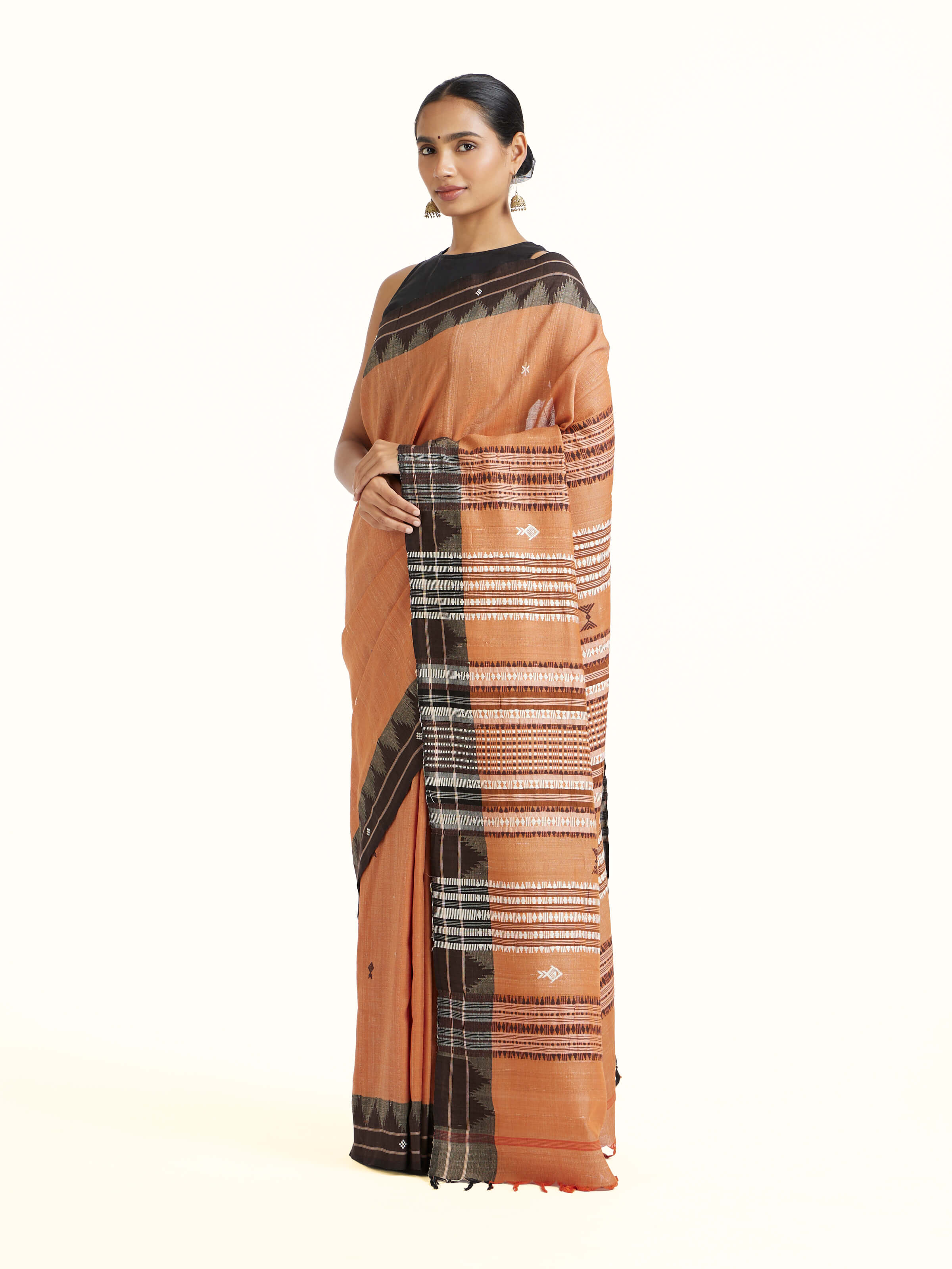 Side view of Brown Cotton Tussar Silk Kotpad Saree highlighting the detailed craftsmanship and elegant silhouette