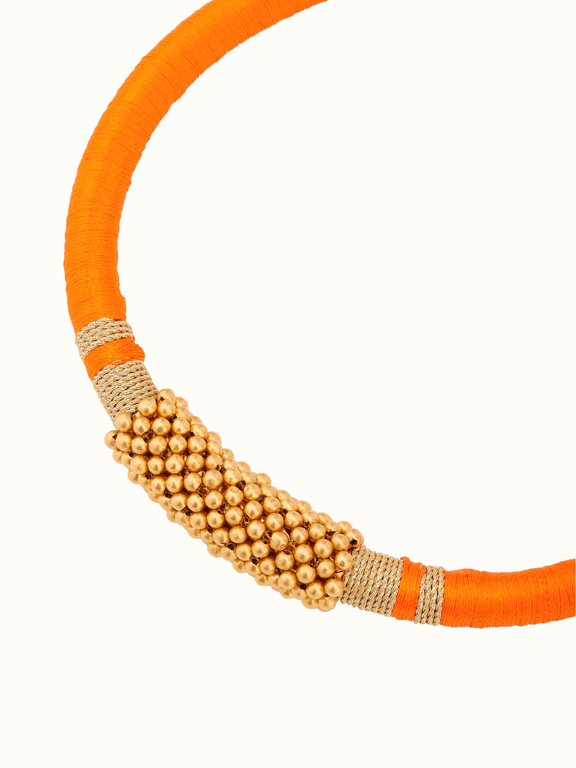 Angled view of Thushi 22 karat gold collar necklace