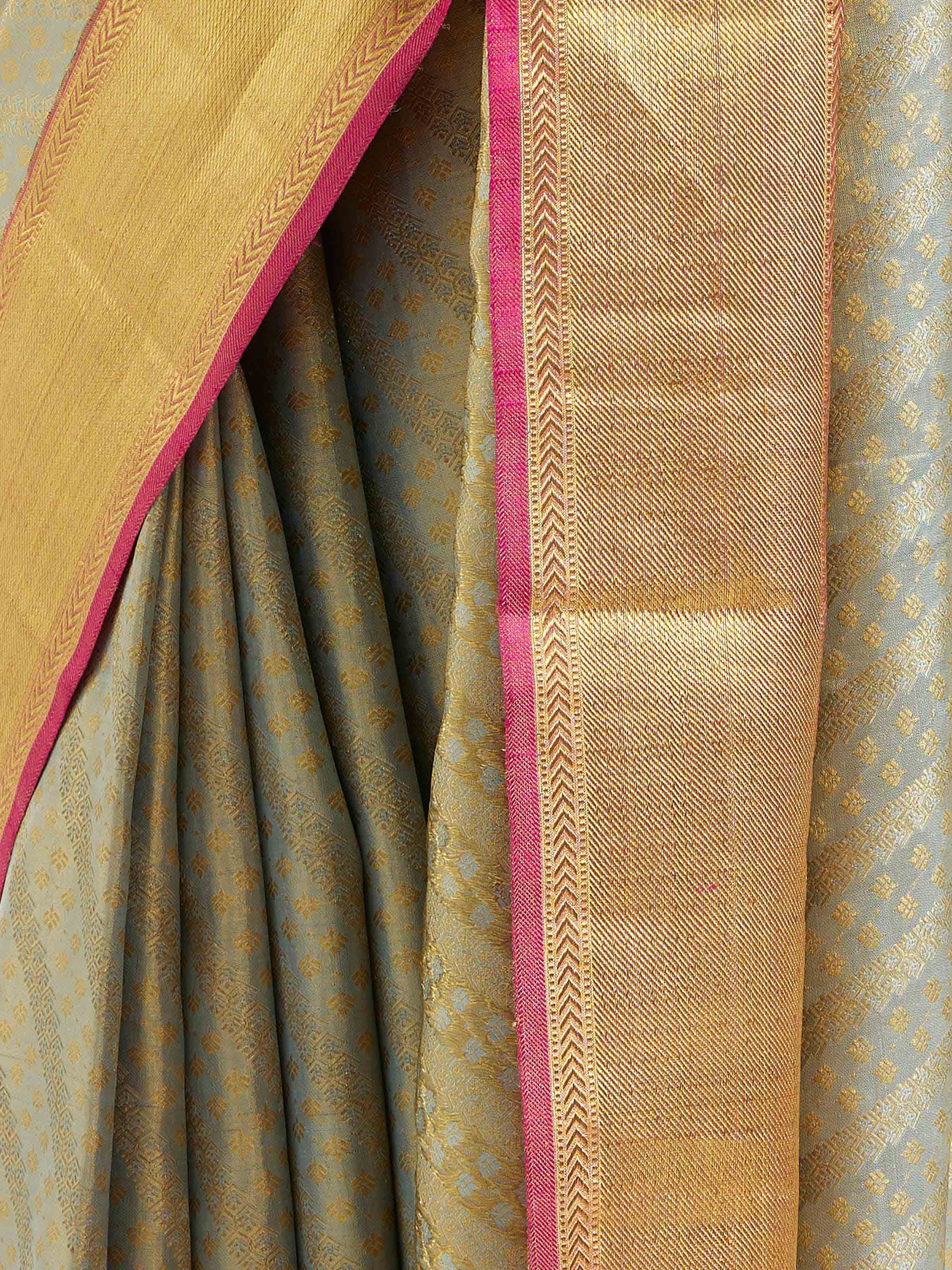 Detail view of pista silk Kancheepuram saree showing zari work
