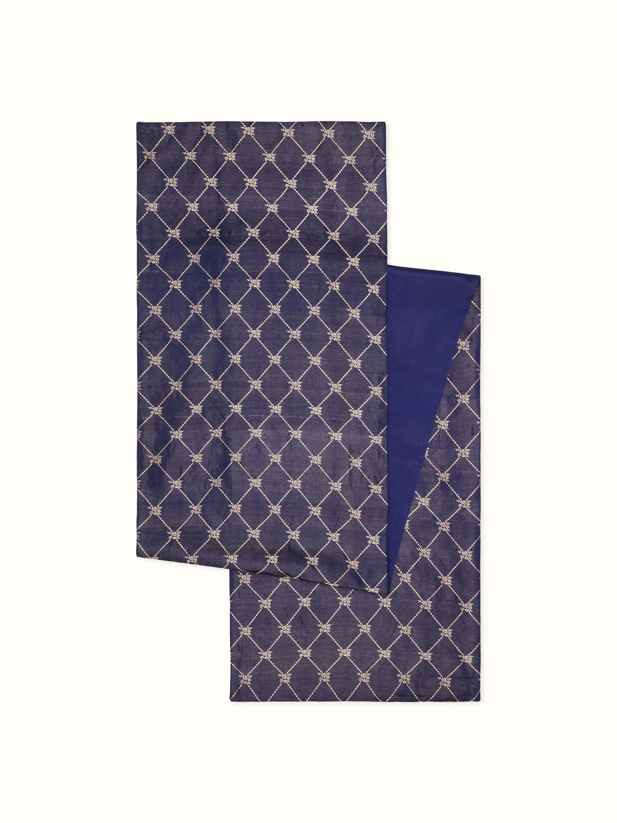 Close-up of shimmering silk texture and gold zari highlights.