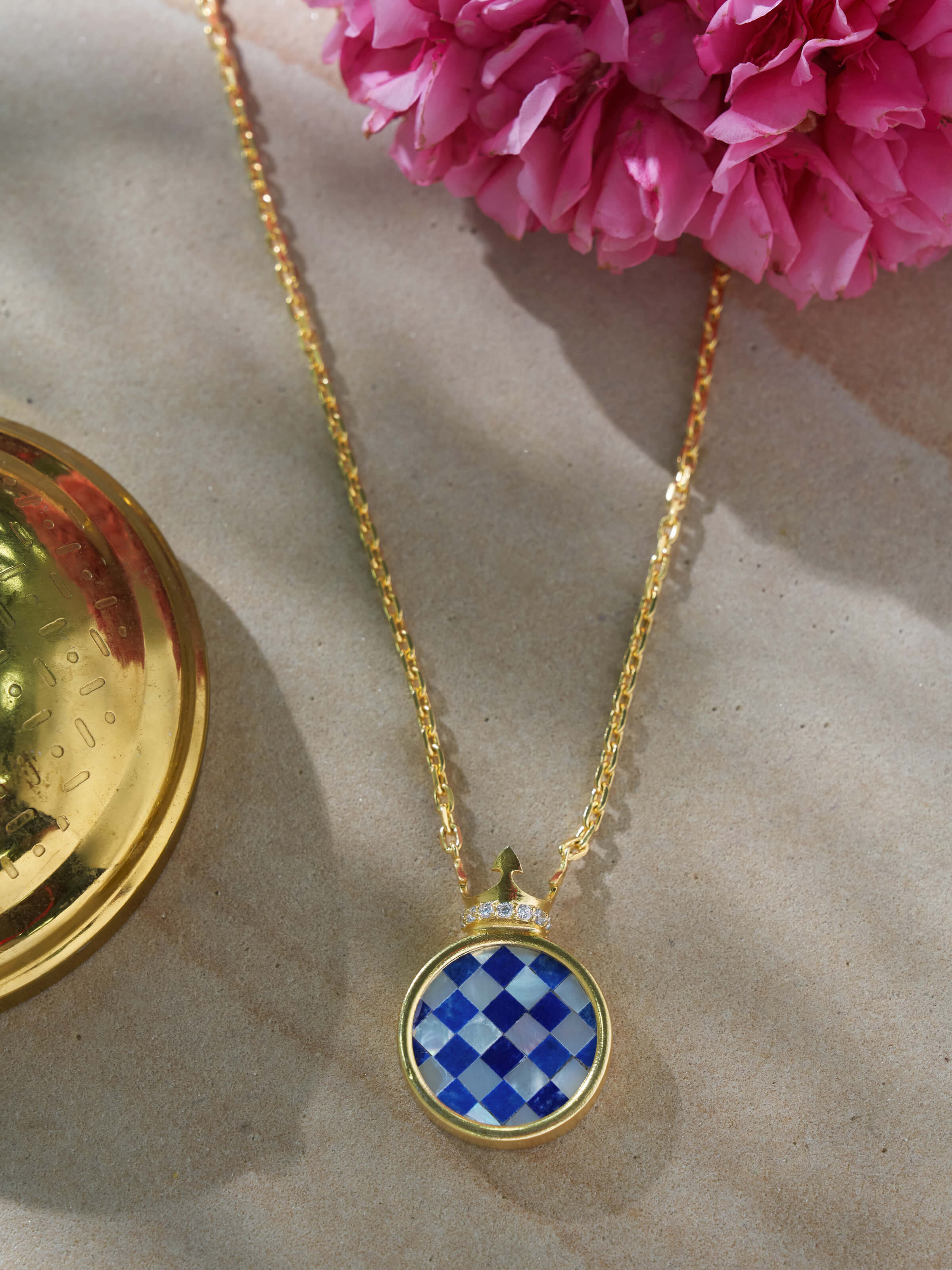 Close-up of Parchinkari silver pendant & chain highlighting the intricate floral enamel pattern and silver finish