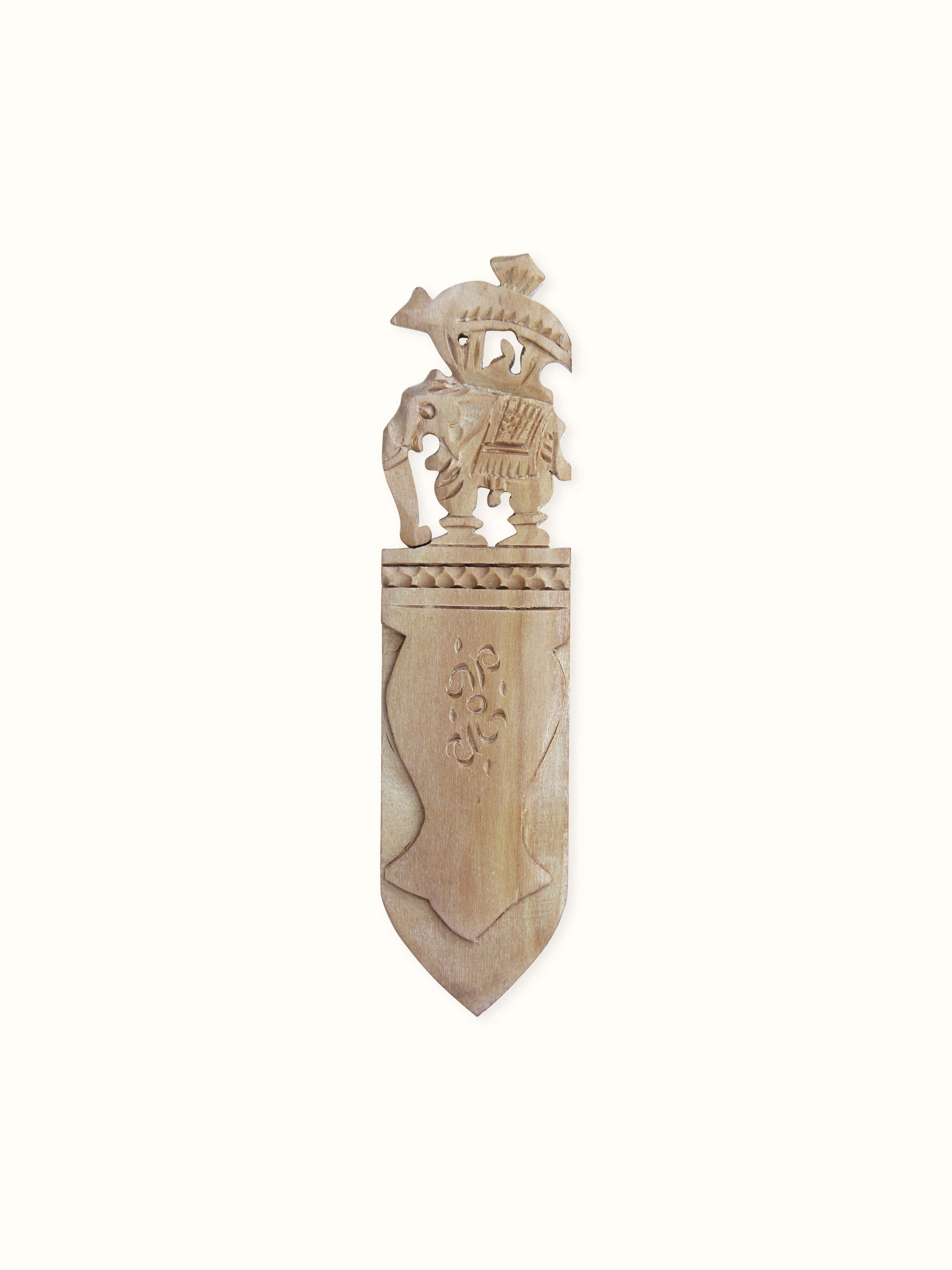 Front view of Carved Sandalwood Elephant Bookmark by Swadesh showcasing intricate carvings and fine sandalwood texture.