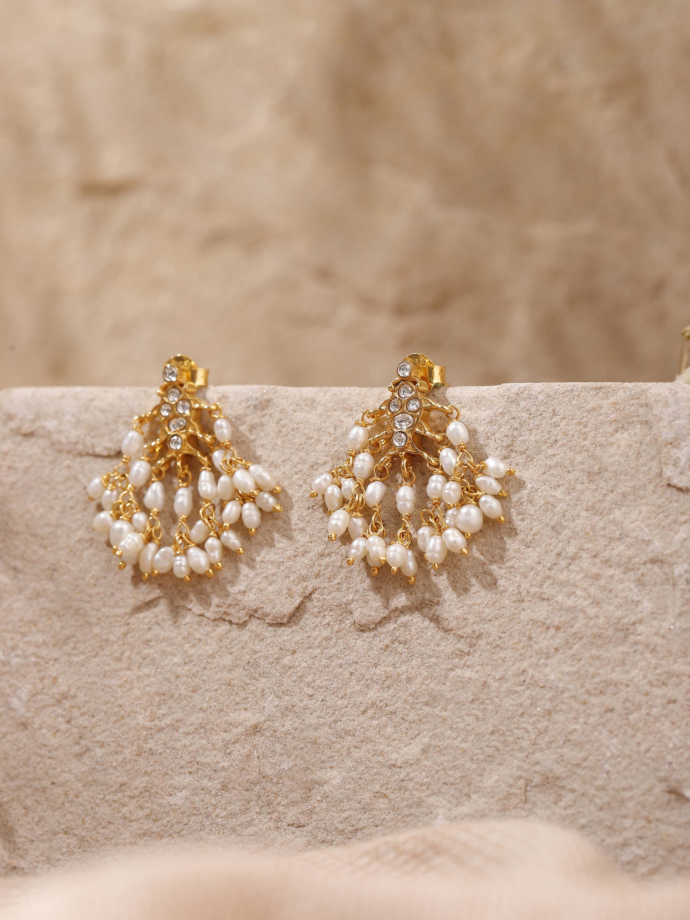 Alternate lifestyle view showing the elongated drop design of Guttapusalu Silver Earrings.