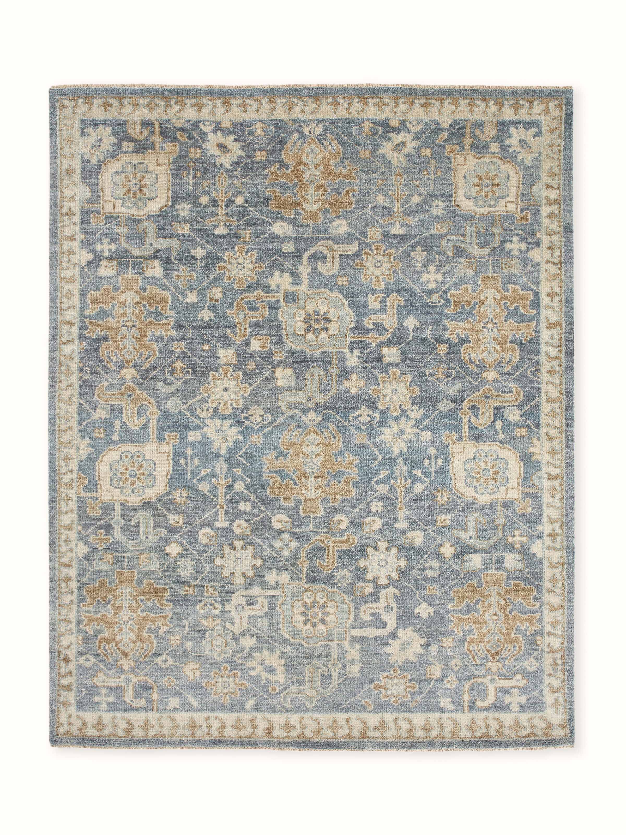 Front view of Oushak-style Bhadohi hand-knotted rug in wool with intricate blue pattern.