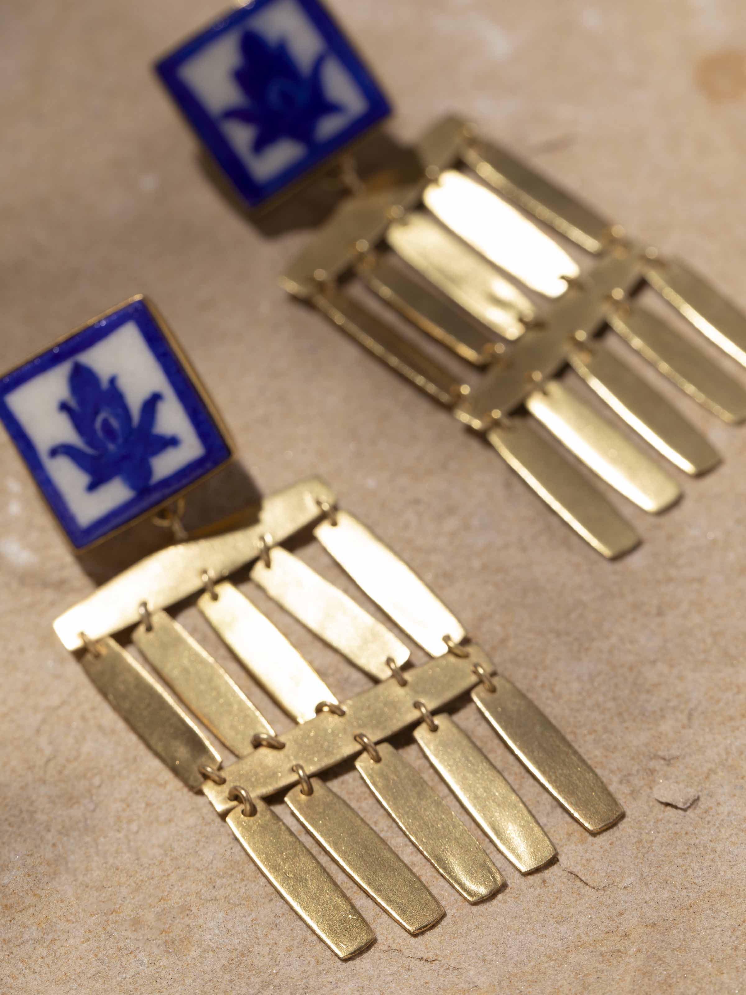 Detailed view of Blue Pottery Drop Earrings focusing on the intricate blue pottery and design