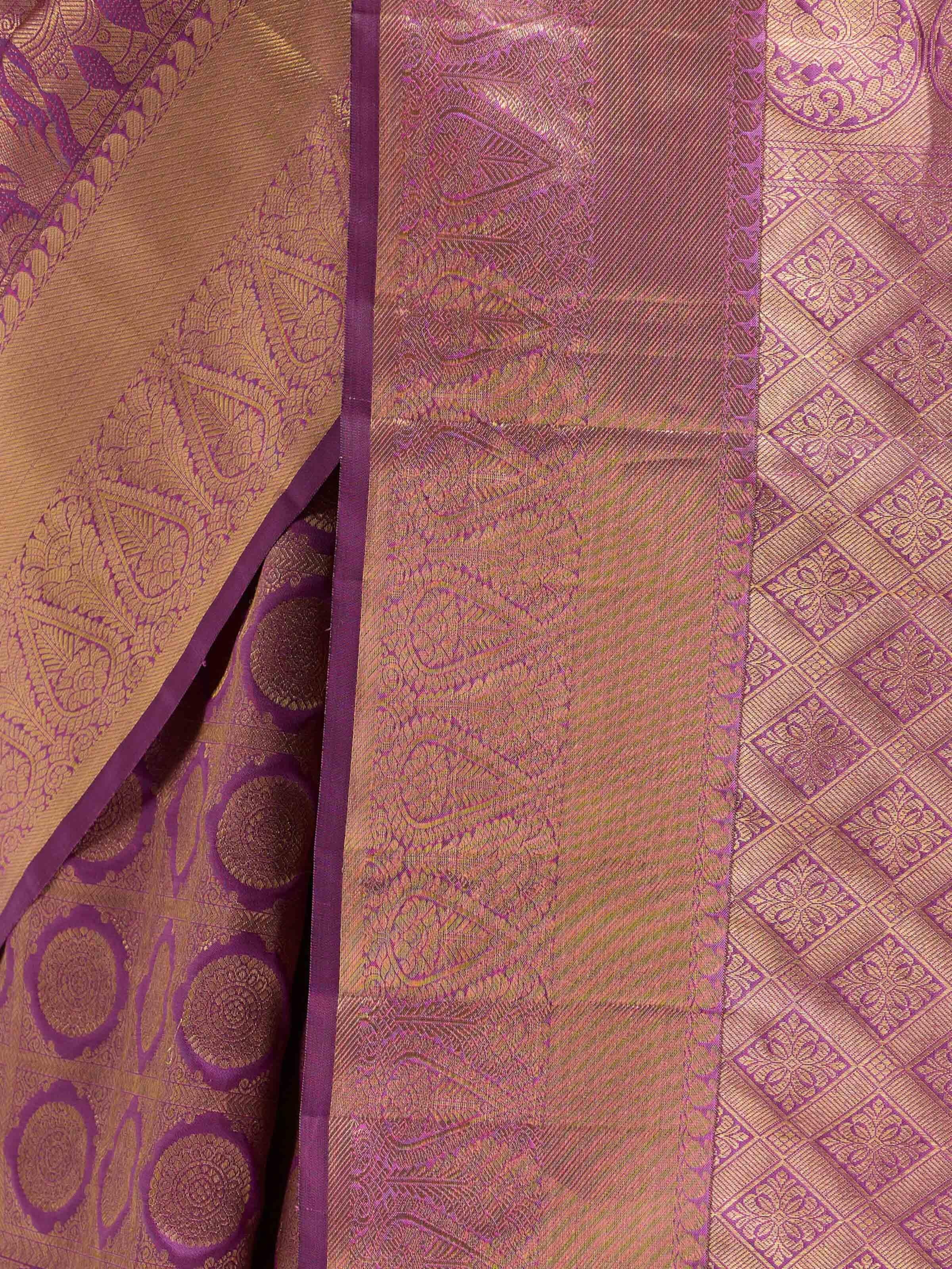 Detail view of purple silk Kancheepuram saree showing zari work