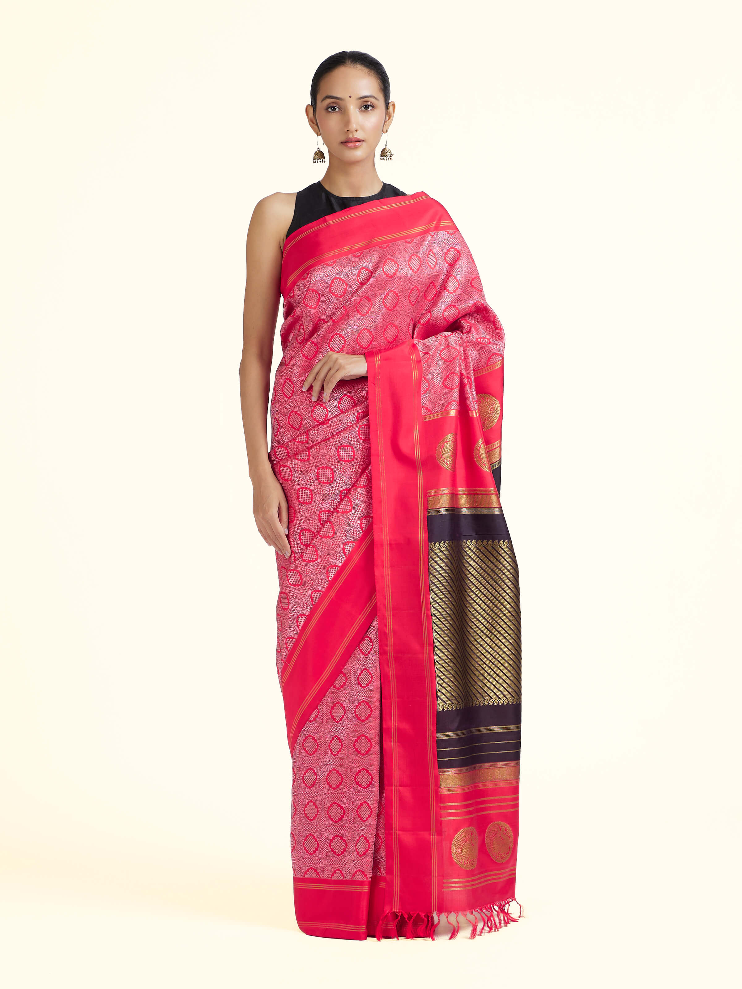 Front view of red silk Kancheepuram saree with rich zari woven motifs