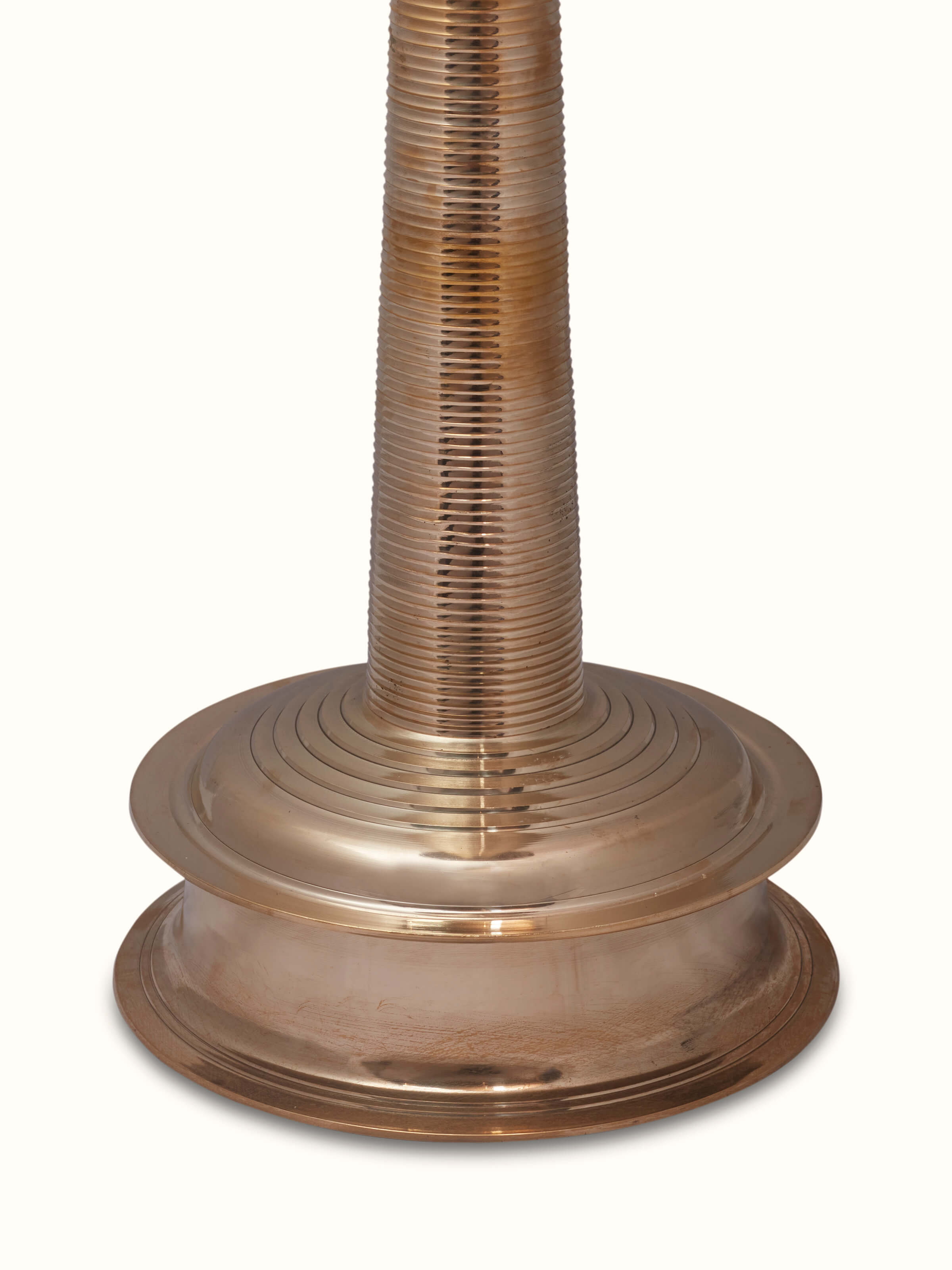 Close-up view of Vilakku brass stand diya showing intricate detailing and polish
