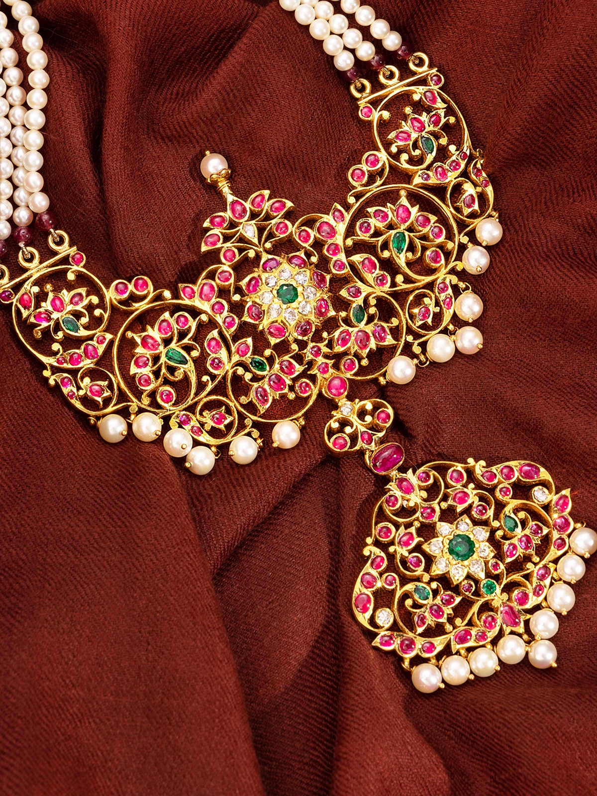 Detailed view of ceramic drop earrings focusing on craftsmanship and colorful details.