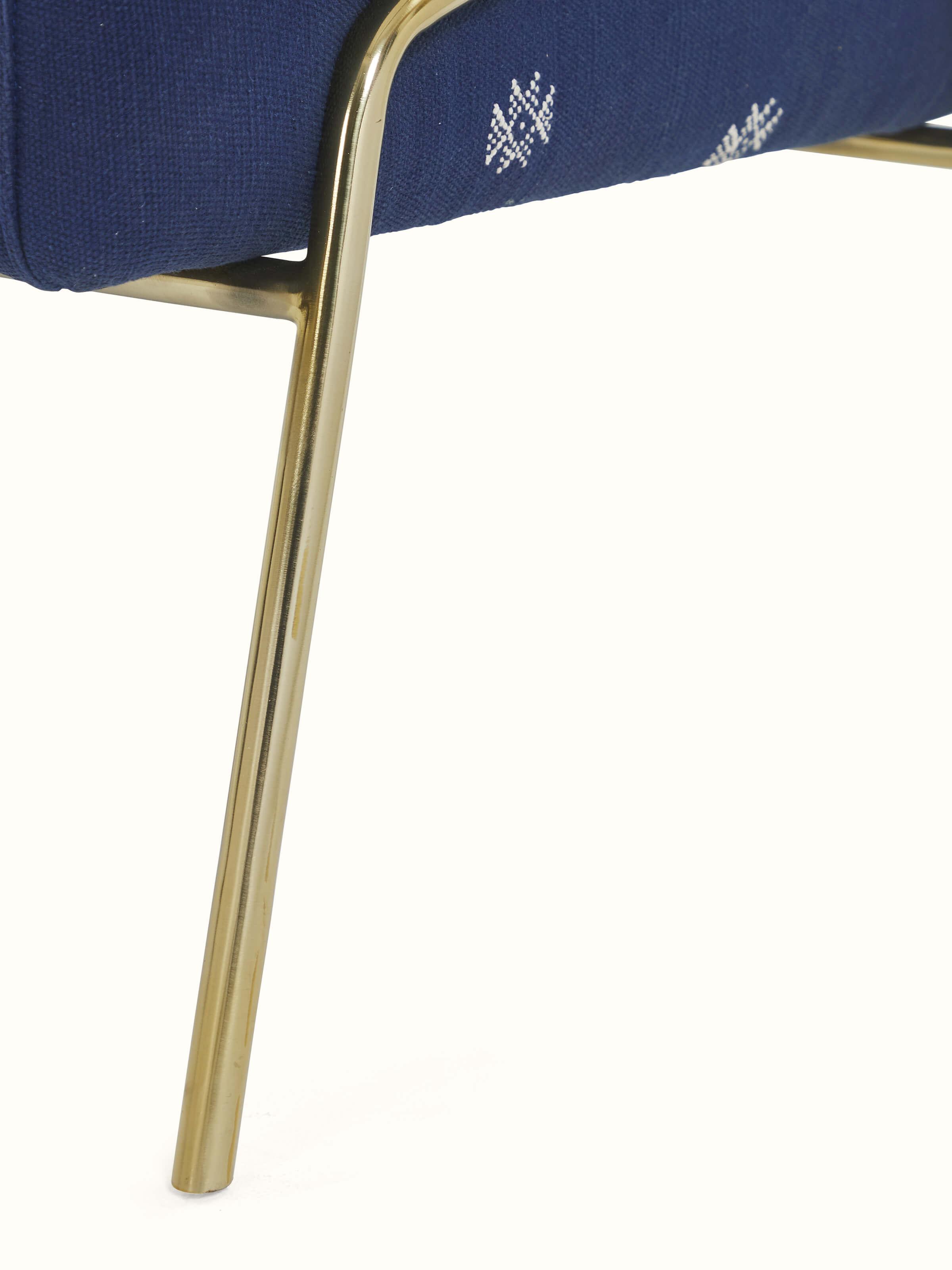 Back view of Upholstered Metal Armchair highlighting the supportive backrest and elegant design.