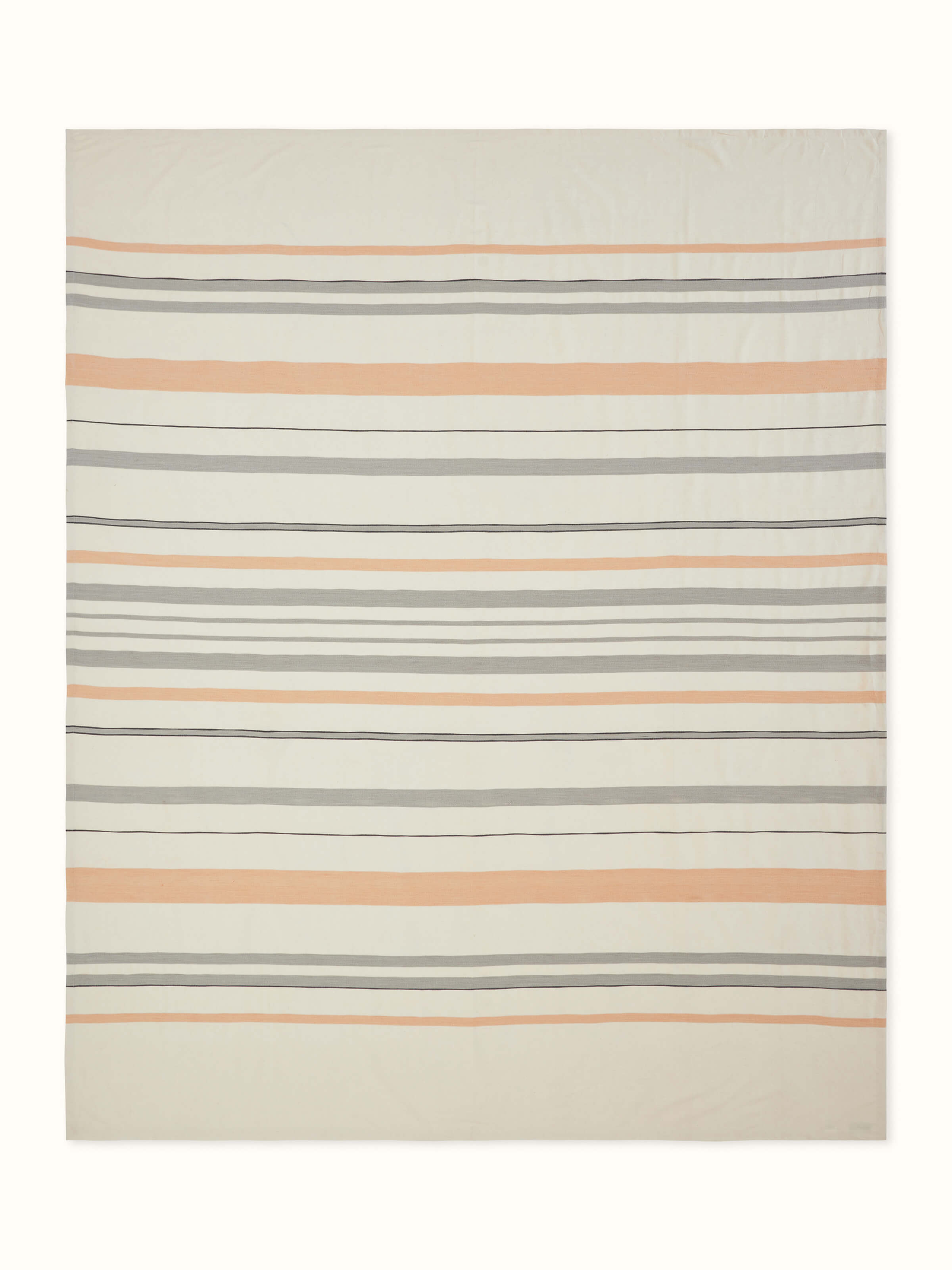 Front view of Neerja grey striped handloom bedspread neatly laid out with matching pillow covers