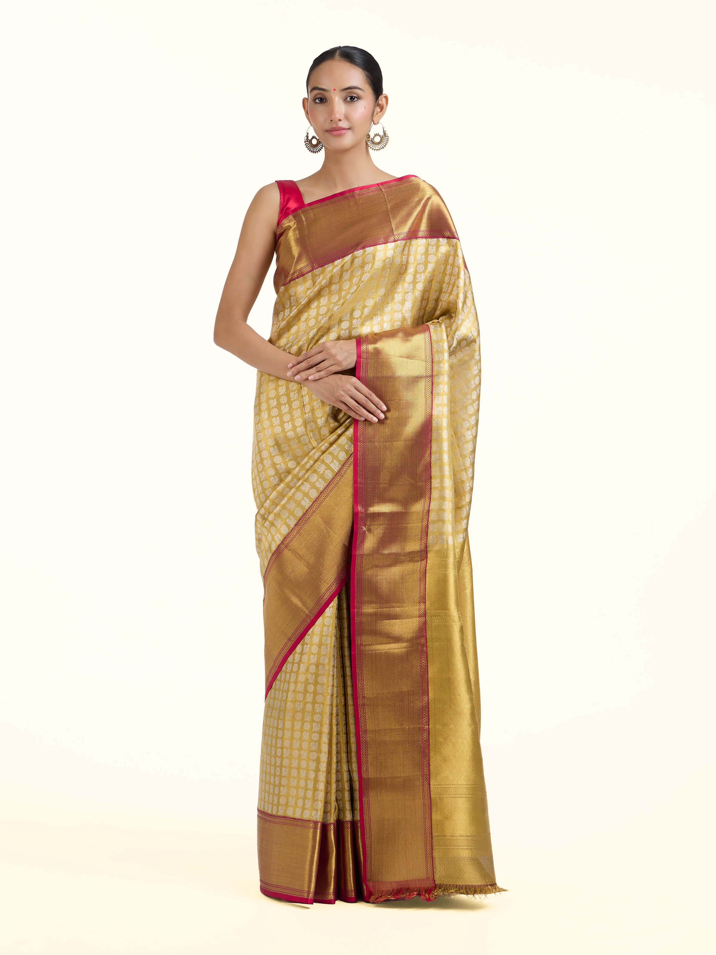 ront view of gold silk Kancheepuram saree with rich zari woven motifs