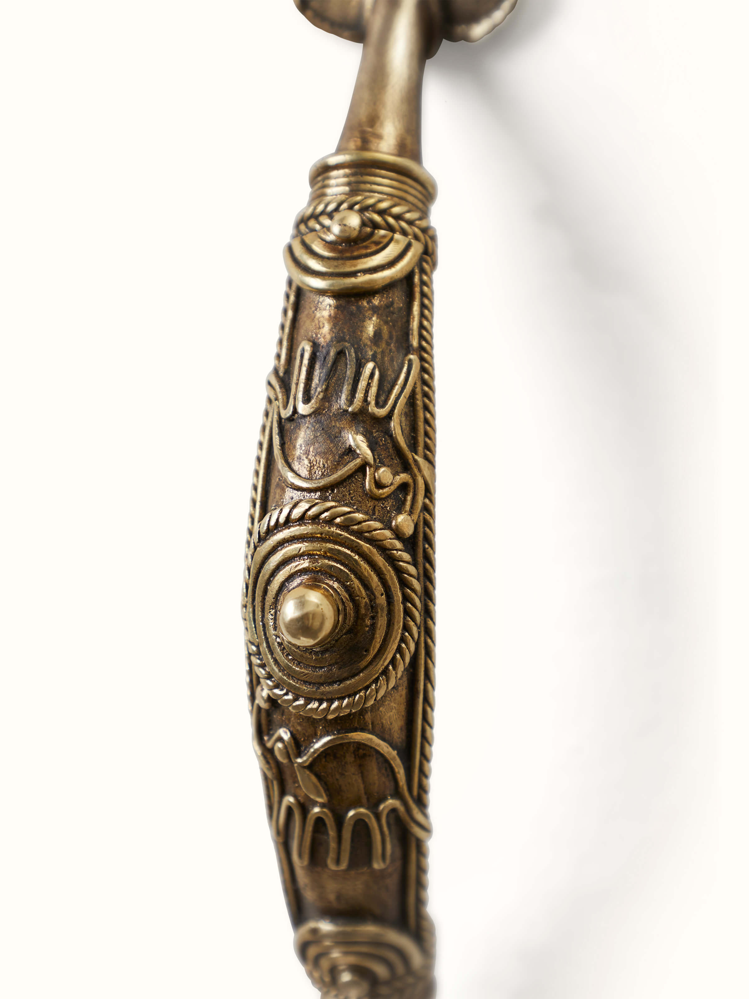 Close-up view of Dhokra Brass Animal Door Handle focusing on the fine brass work and artistic elements