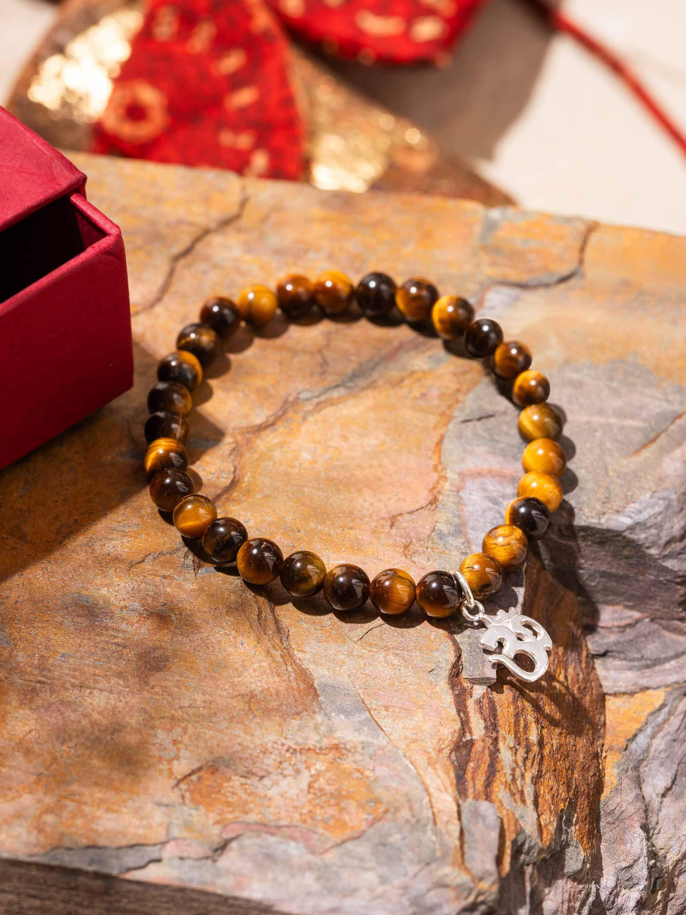 Side view of handcrafted silver bracelet with Tiger Eye and Black Onyx stones in polished finish