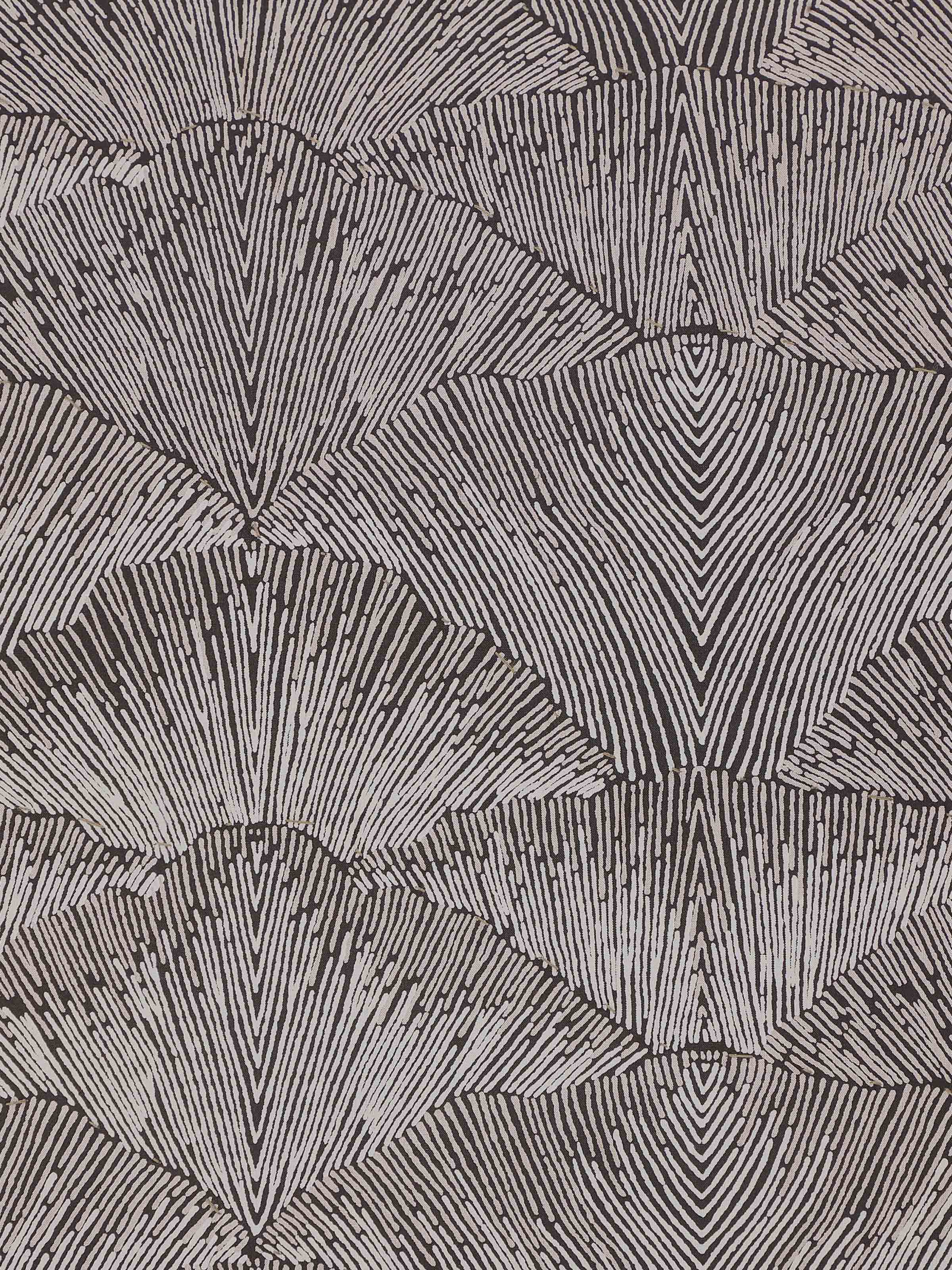 Close-up of Parvat brown silk cushion cover showing raised texture and neat hand block print precision.