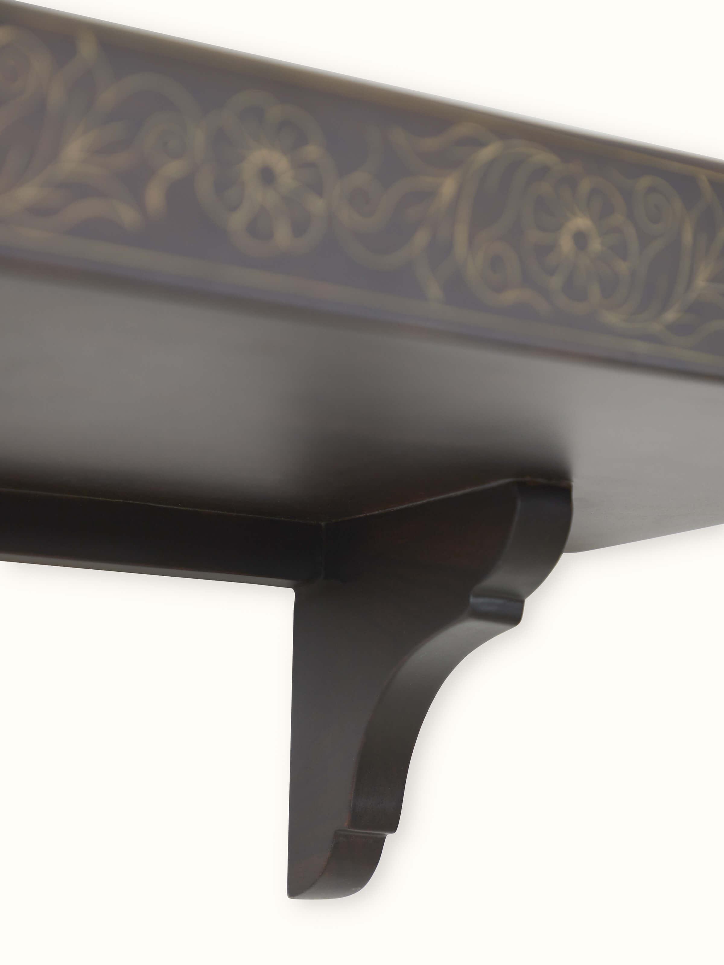 Close-up view of Sheesham Wood & Brass Tarkashi Wall Shelf, focusing on its smooth wood surface and brass detailing