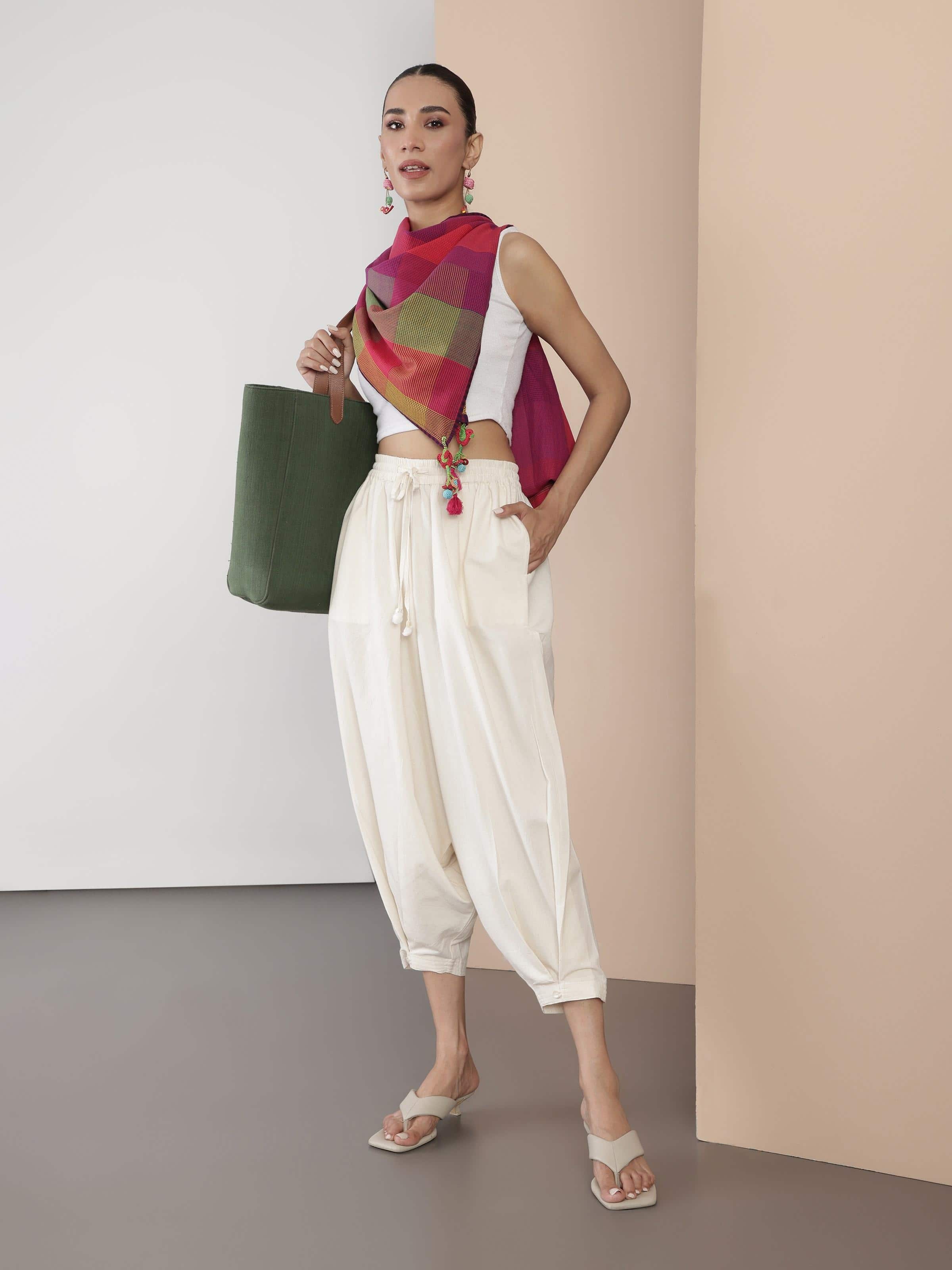 Lifestyle view of cotton harem pants styled with a top for a casual bohemian look