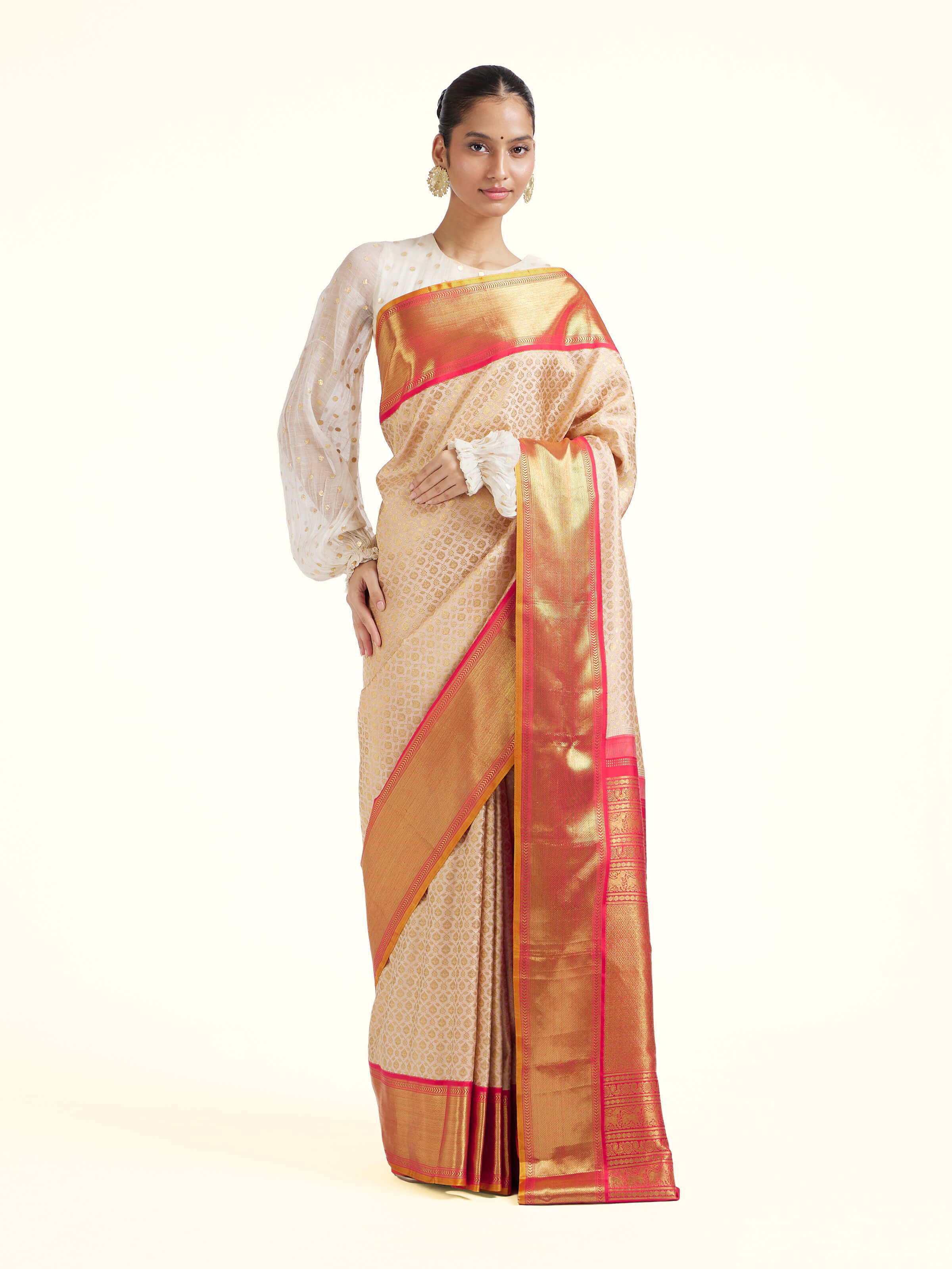 Front view of onion pink silk Kancheepuram saree with rich zari border