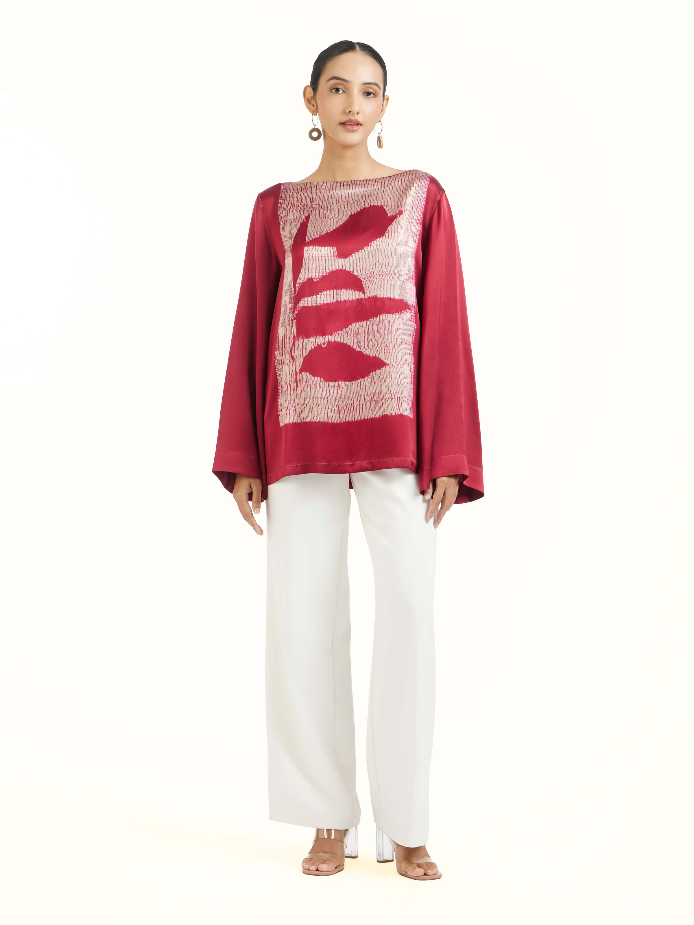 Front view of red satin Shibori top showcasing bright hue and smooth texture