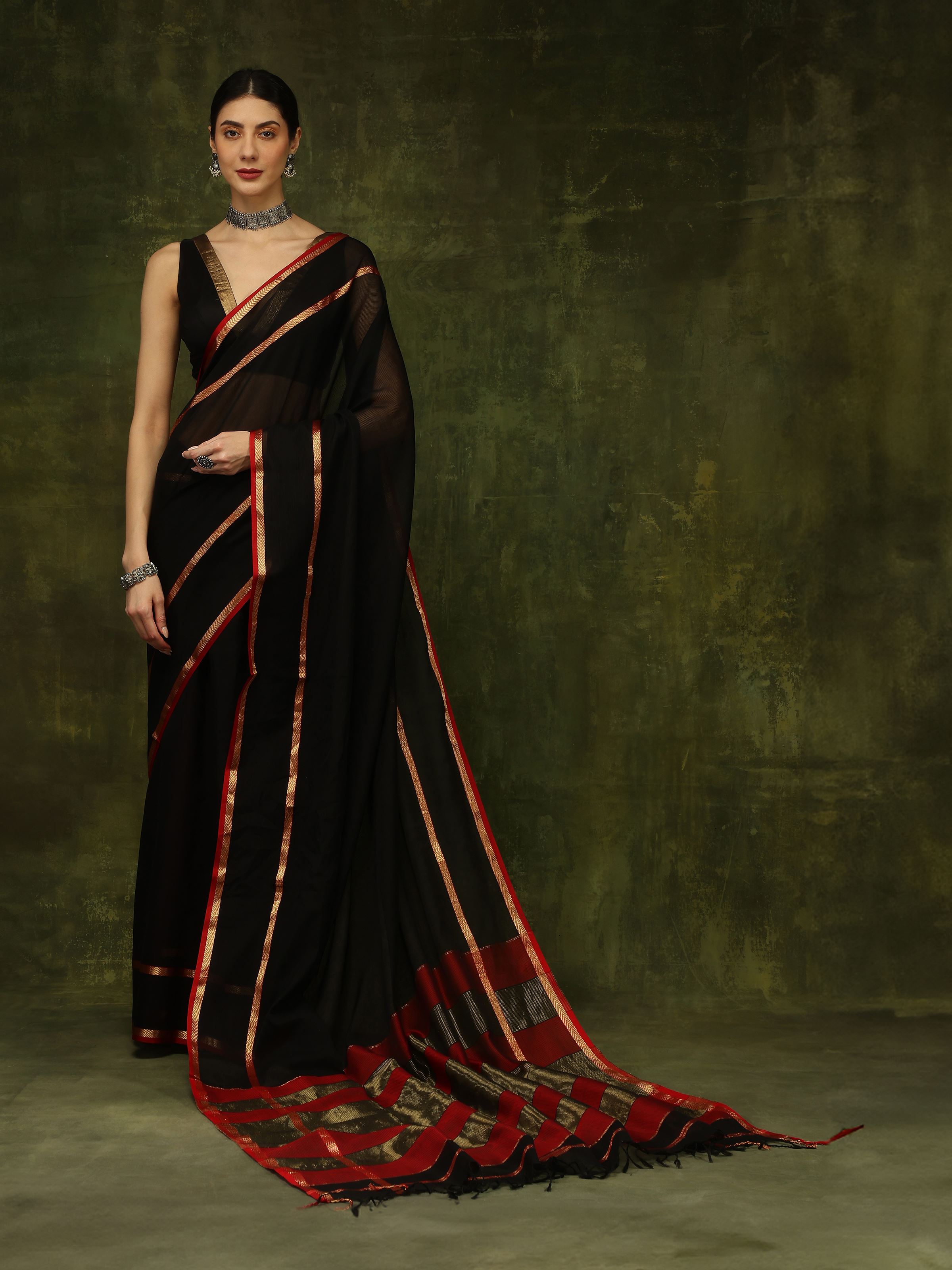 Angled view of black cotton silk Maheshwari saree with woven motifs
