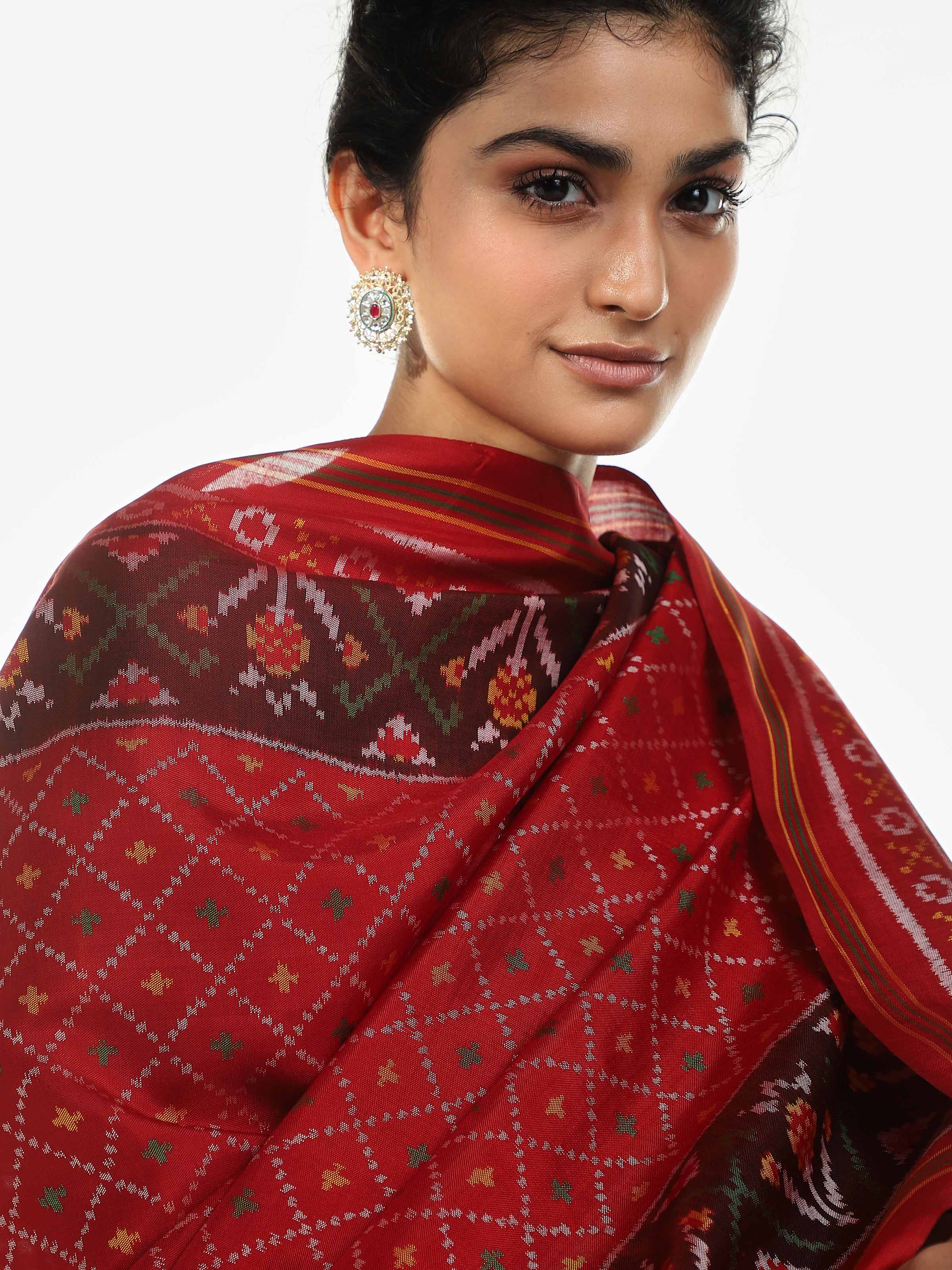 Detail view of red silk Patola dupatta highlighting traditional craftsmanship