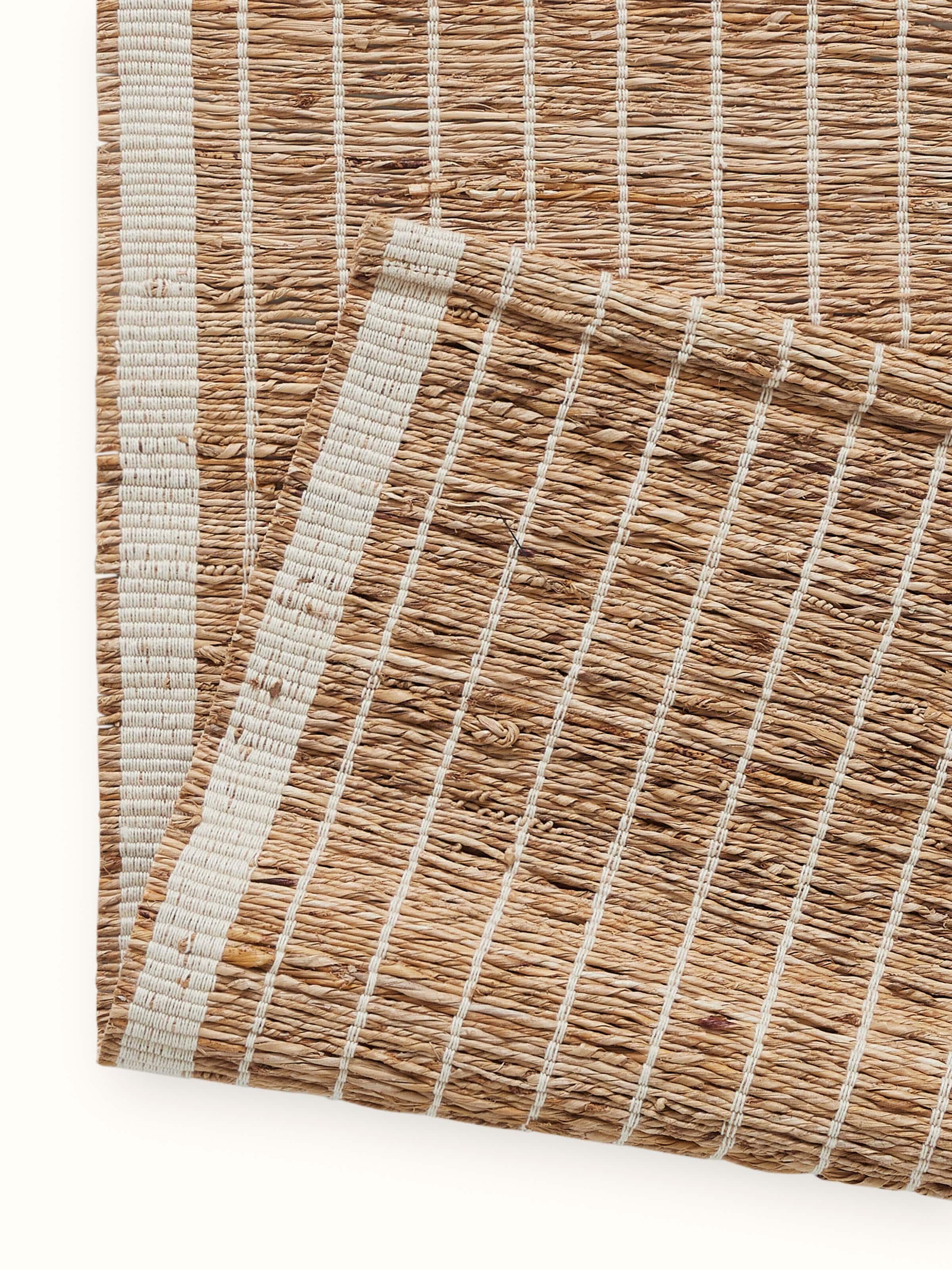 Artistic shot focusing on the soft sheen and durability of the runner’s woven stripes