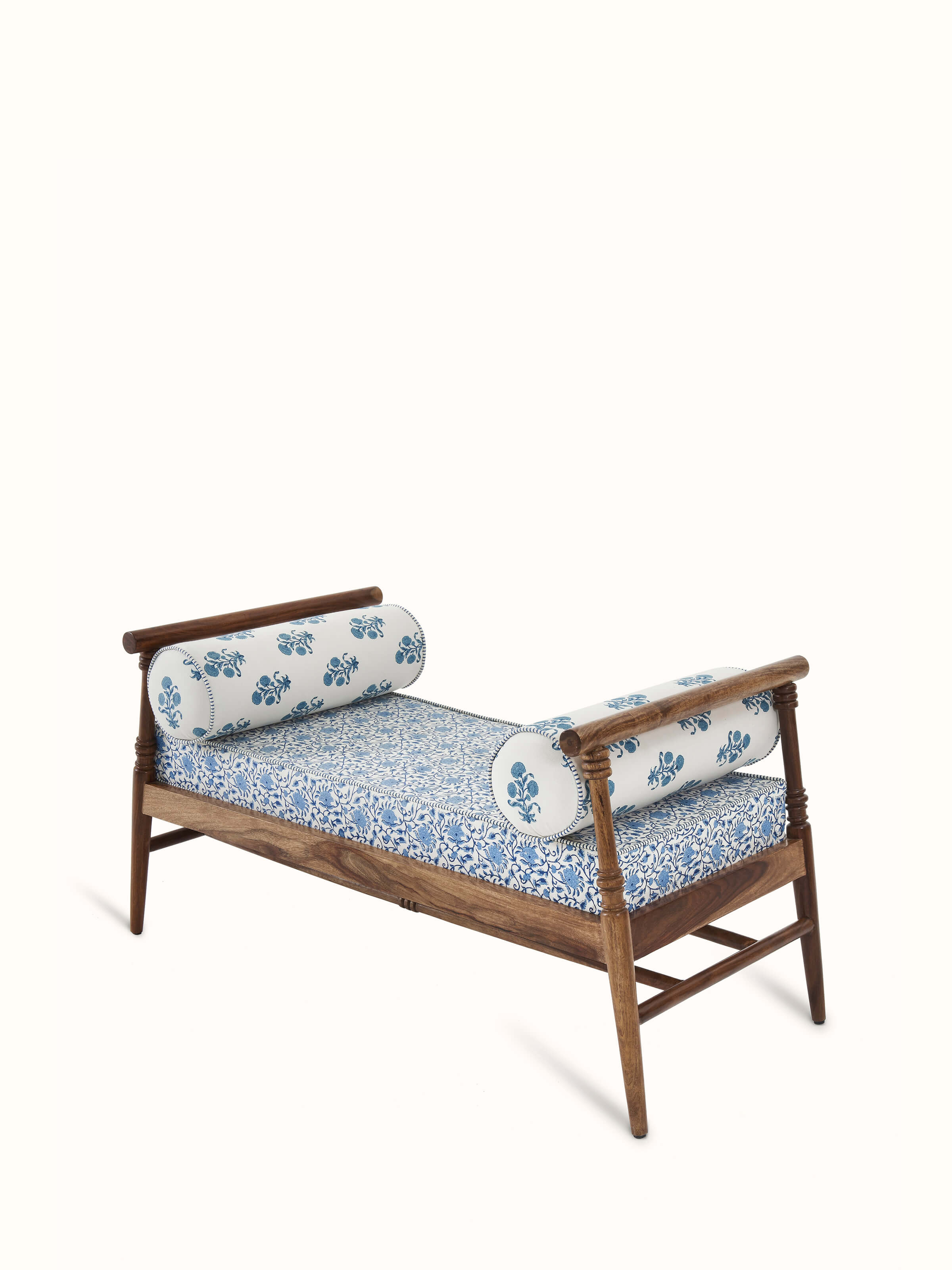 Angled view of the Sheesham wood bench showcasing the intricate Sanganeri block print and leg design
