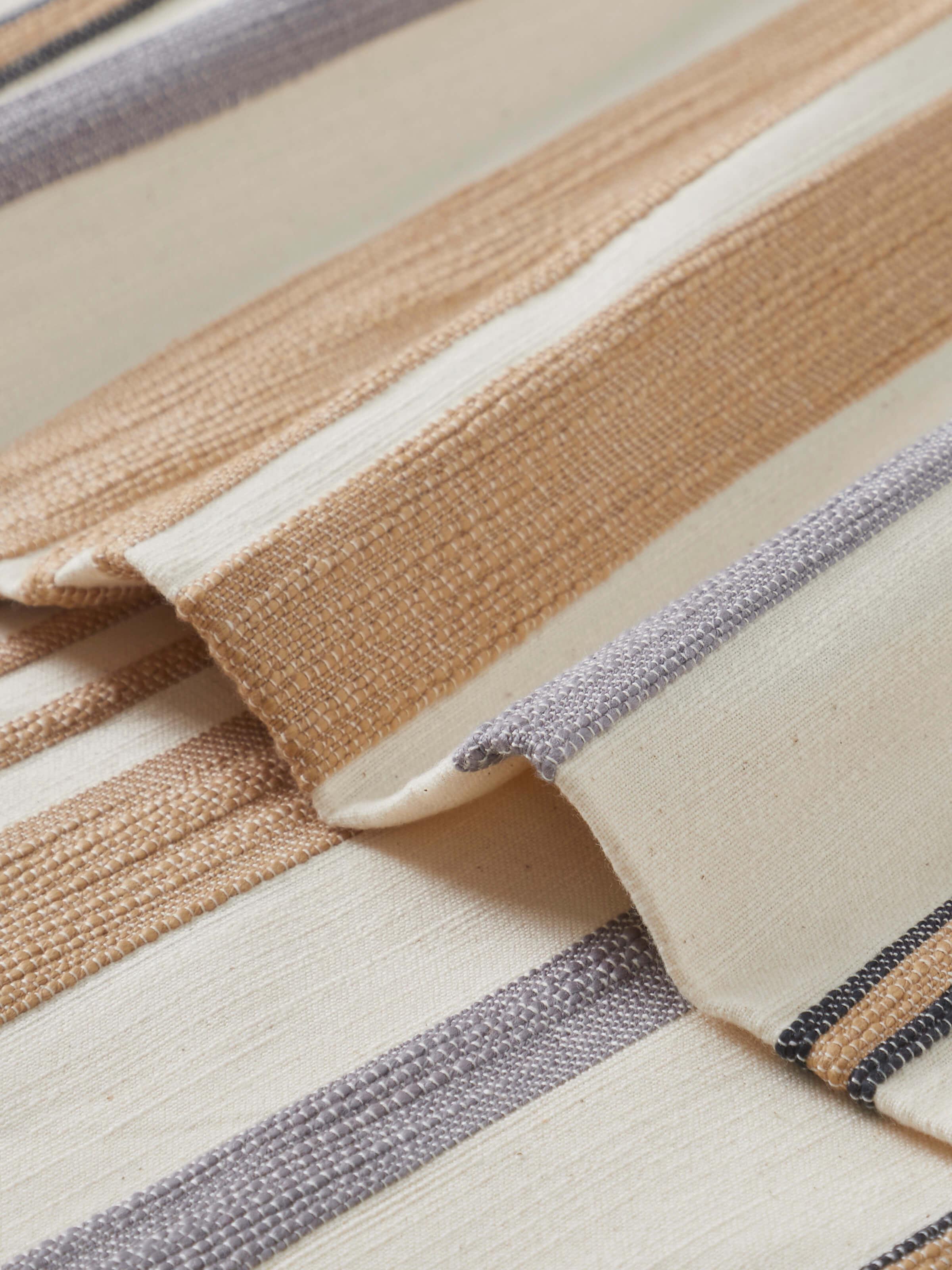 Close-up of Neerja Beige Stripe Cotton Bedspread Set, showcasing the subtle stripe pattern and handloom craftsmanship.