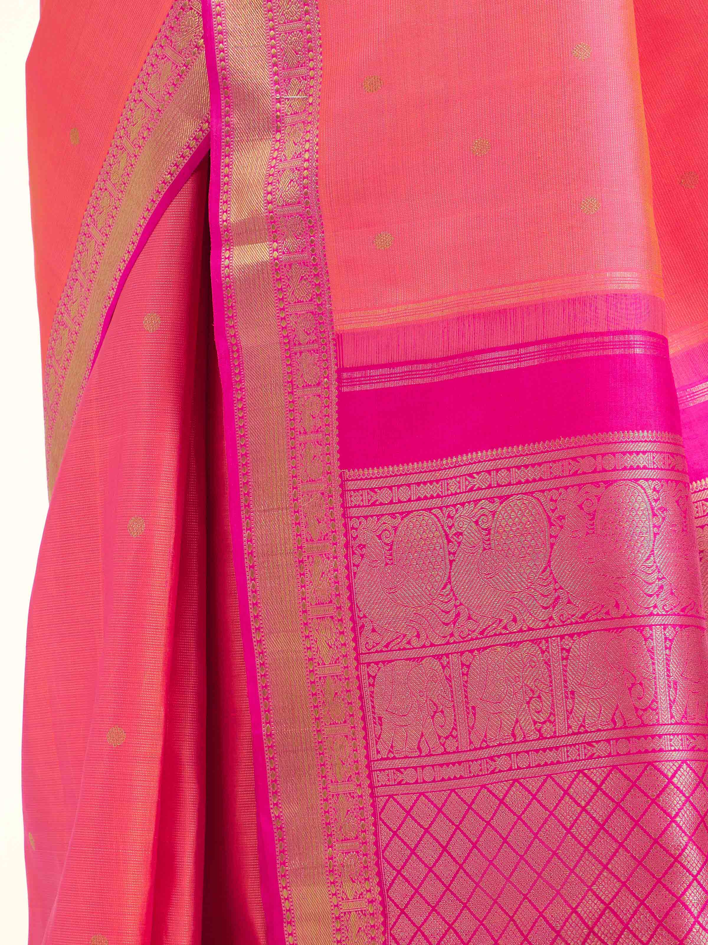 Detail view of pink silk Kancheepuram saree showing silk texture and zari weaving