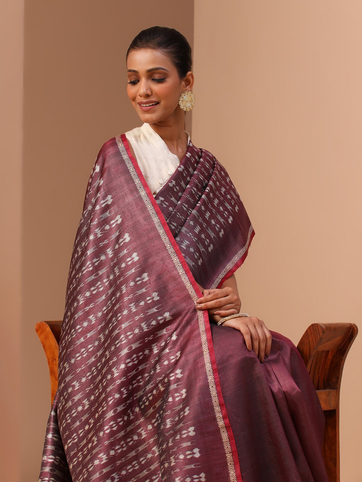 Another angled view of purple tussar silk Odisha Ikat saree emphasizing traditional weaving.