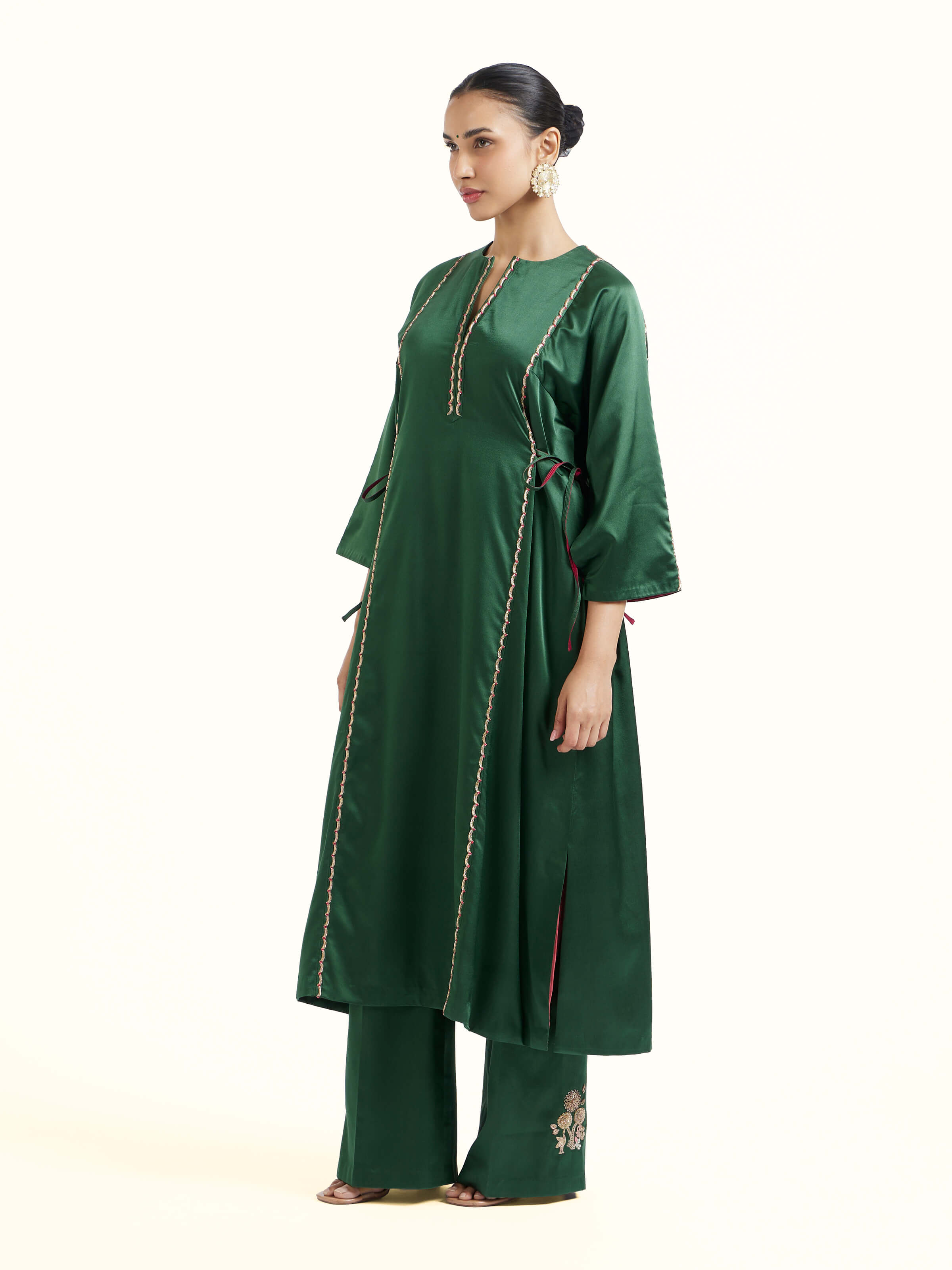 Side view of emerald green silk Banarasi co-ord set highlighting coordinated silhouette