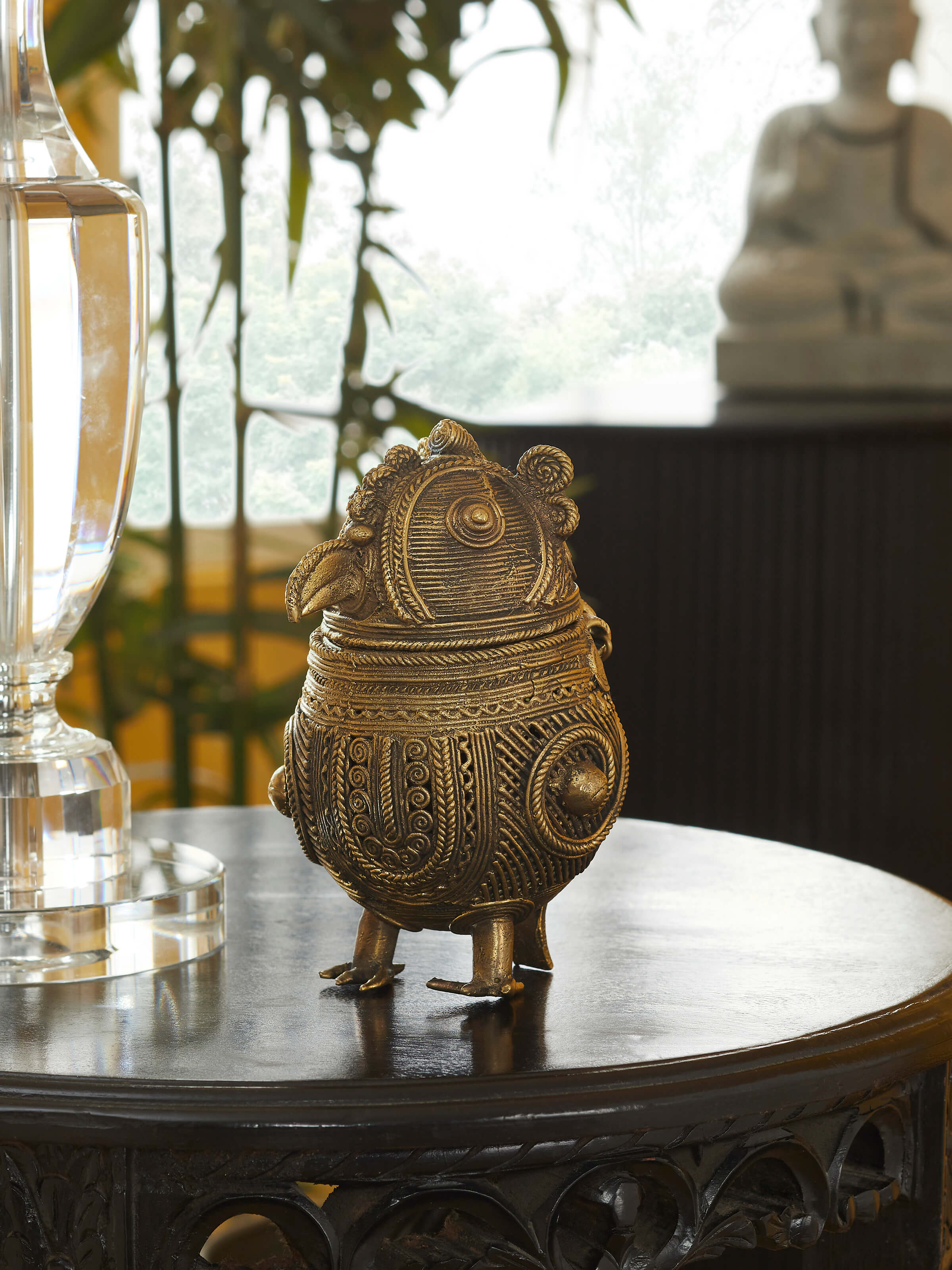 Dhokra art brass owl shape box showing side profile and carved textures