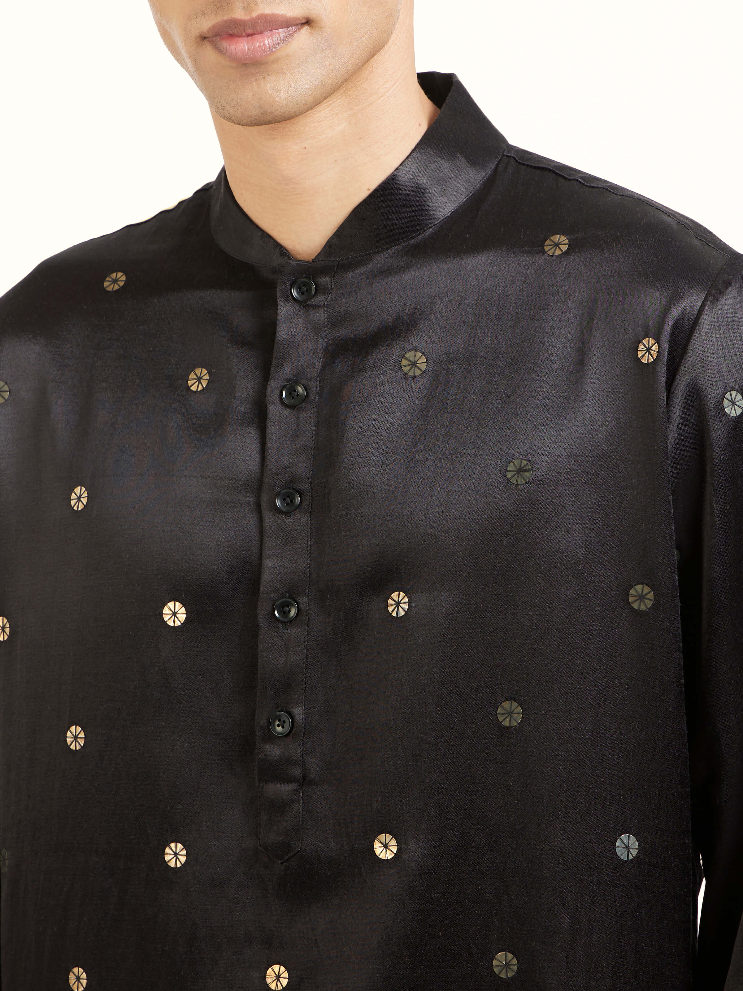 Detail view of black hand embroidery long kurta showing fabric texture