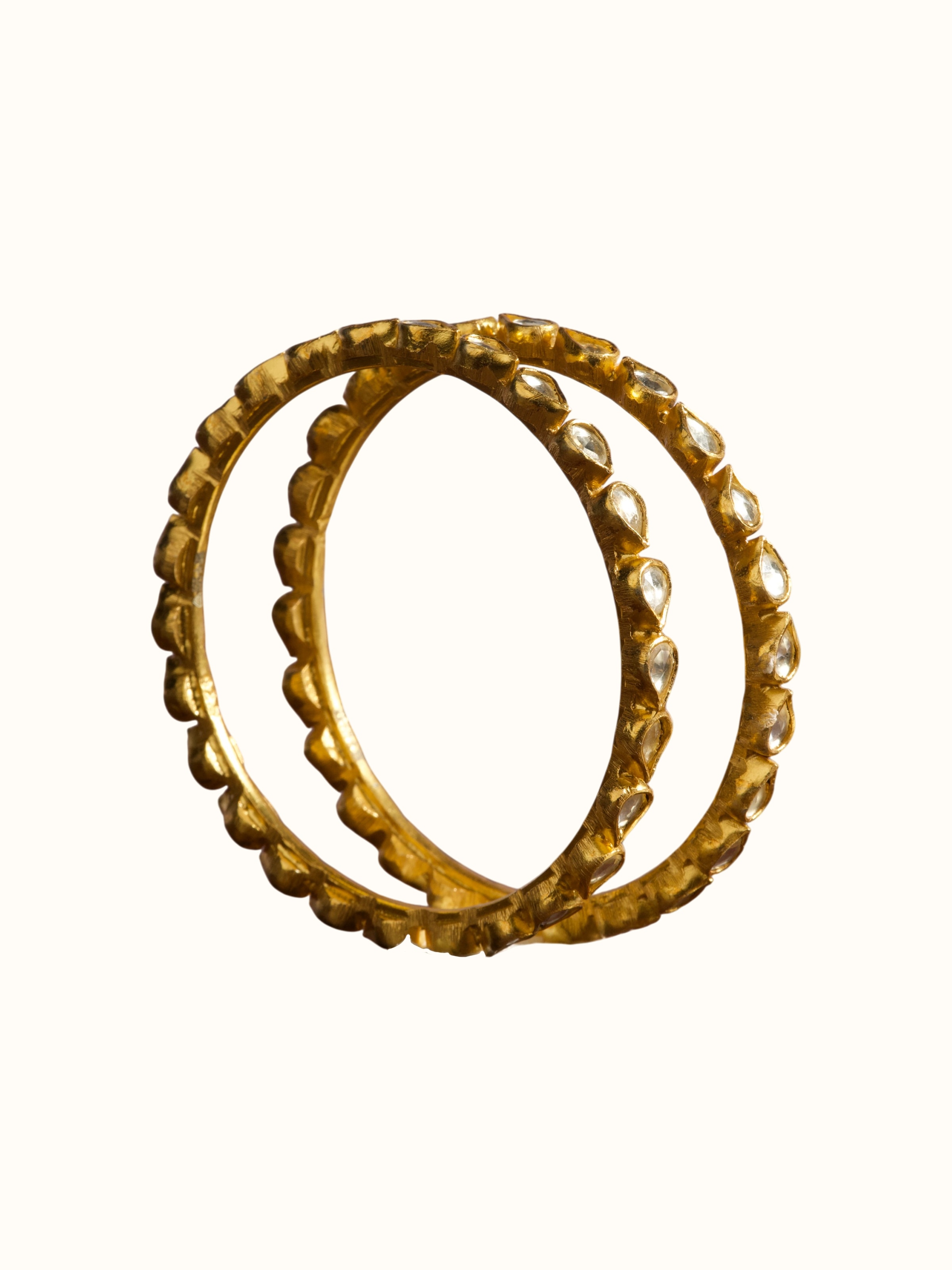 angled view of silver smithing gold plated bangle