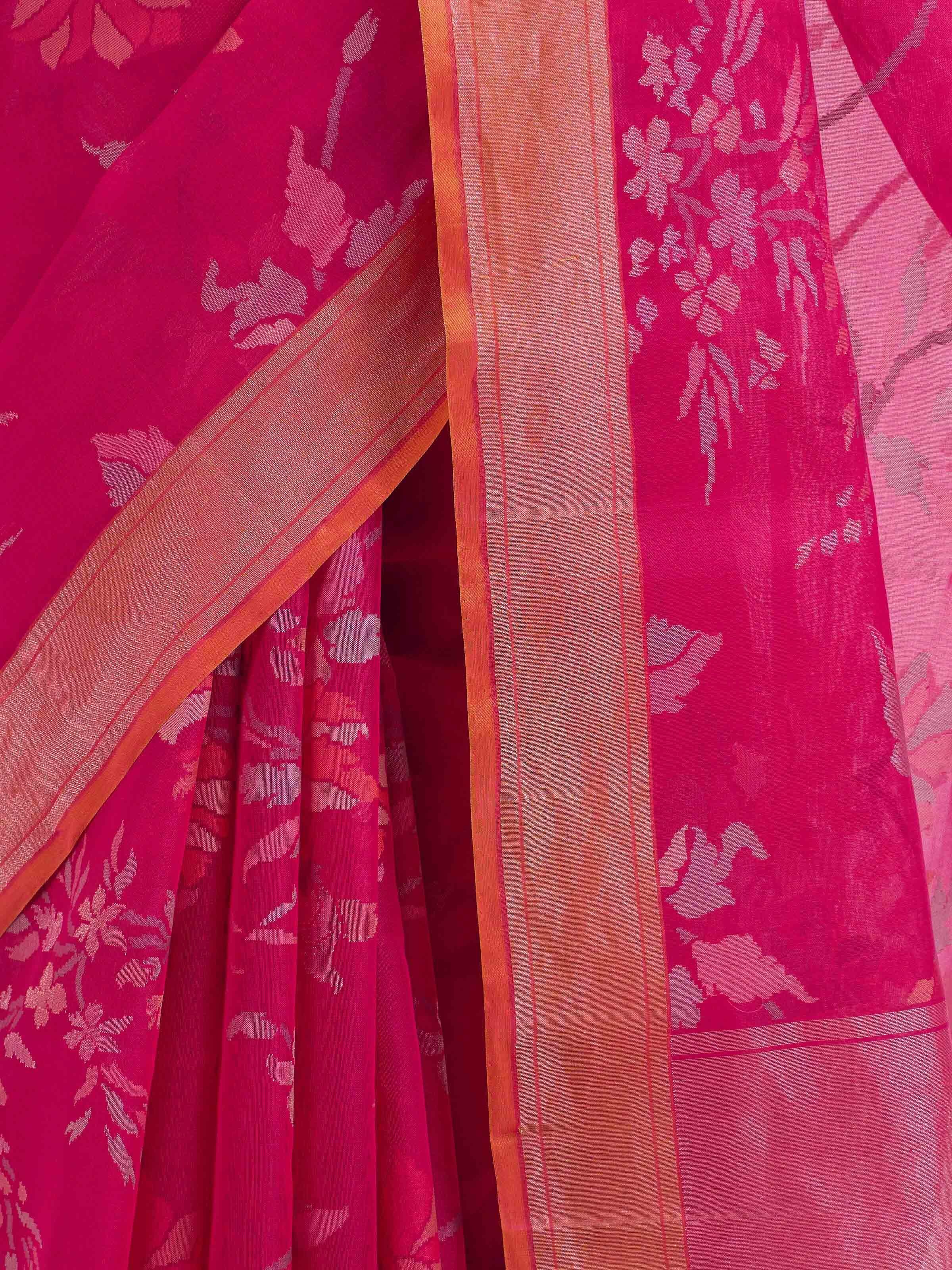 Detail view of pink cotton Awadh Jamdani saree showing cotton texture and craftsmanship